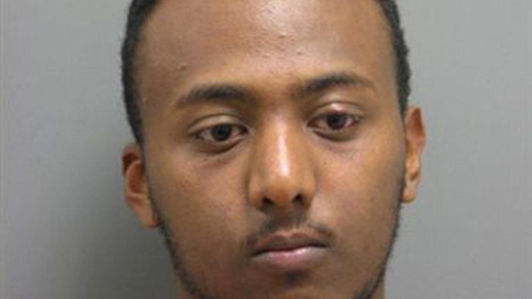Yonathan Melaku is charged with four counts of grand larceny.