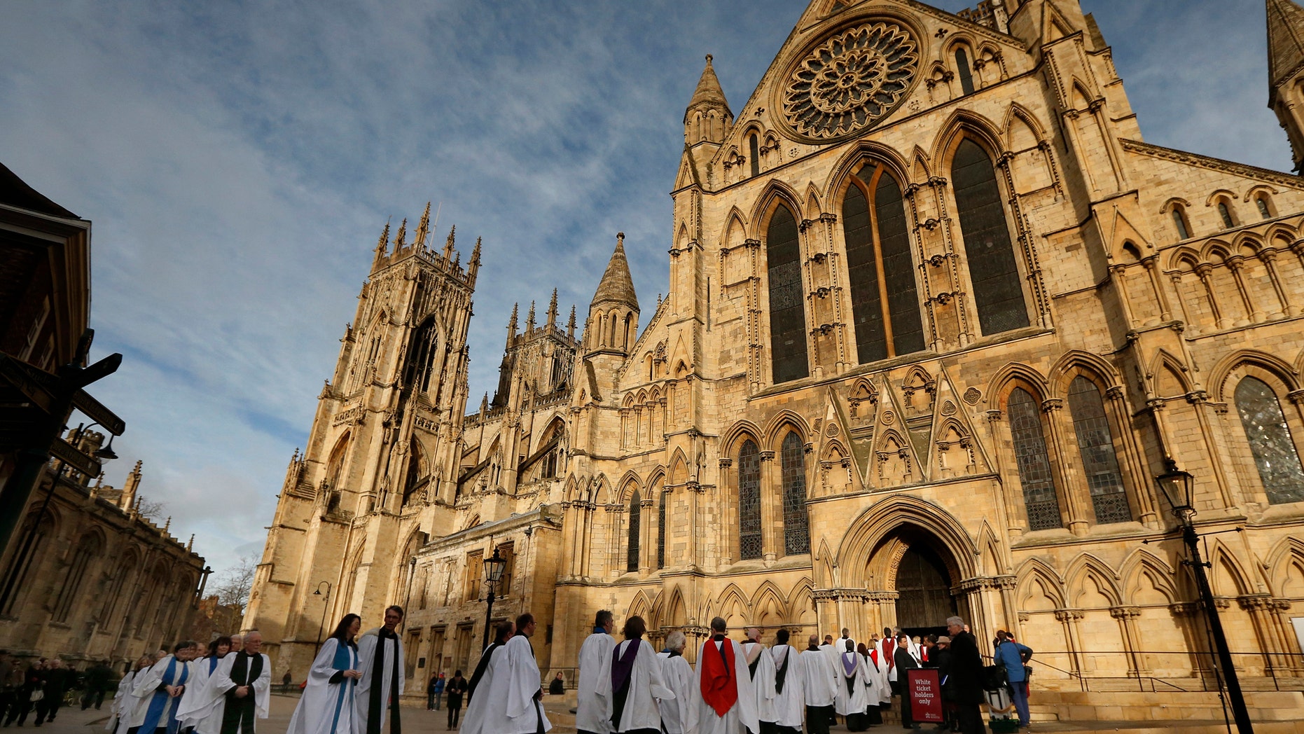 File photo - Members of the clergy enter York Minster before a service to consecrate Reverend Libby Lane as the first female bishop in the Church of England, in York, northern England January 26, 2015. (REUTERS/Phil Noble)