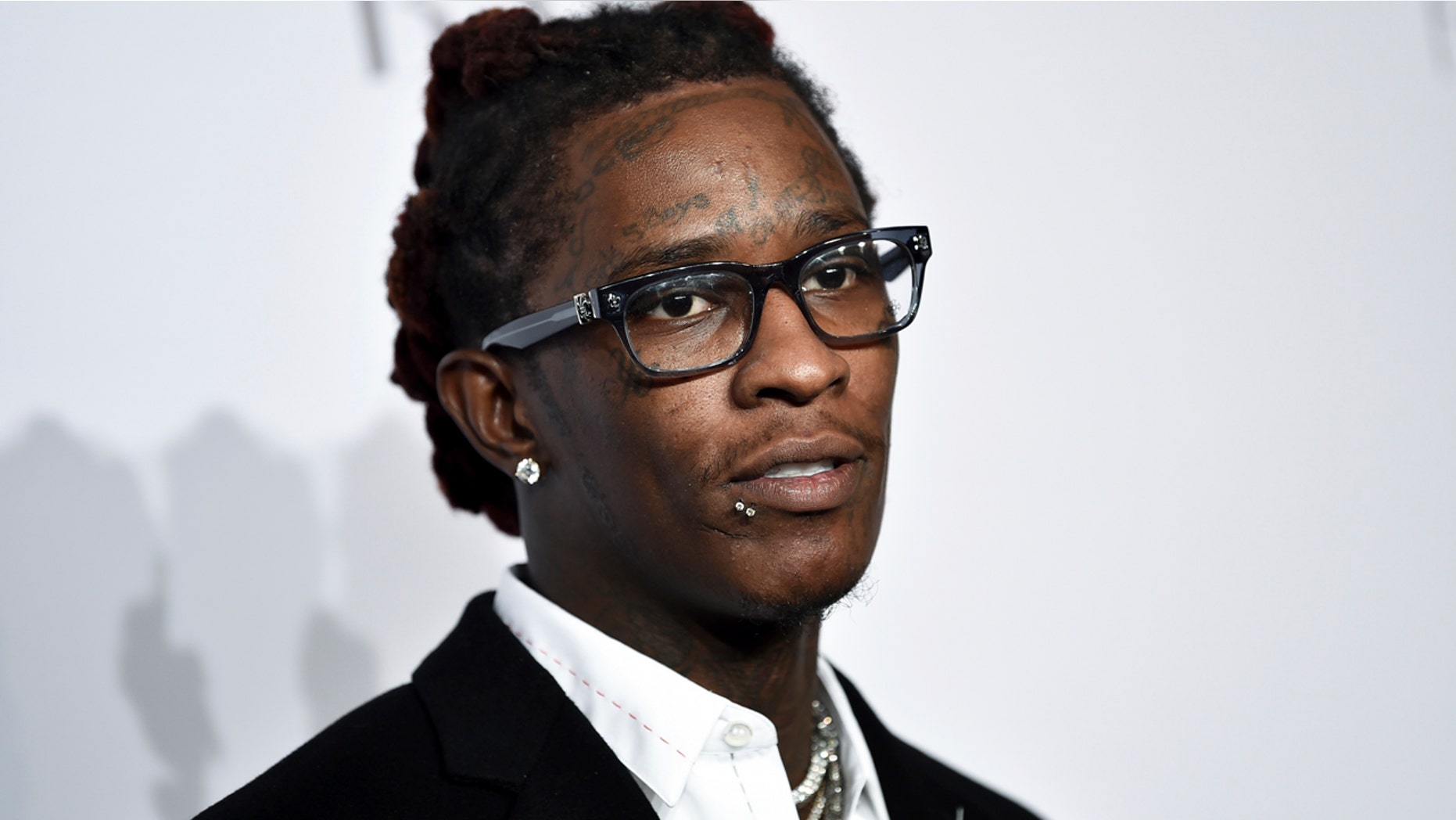 Police say the rapper was arrested in Los Angeles after officers found a concealed firearm inside his car. Officer Drake Madison says Friday, Aug. 17, 2018, the rapper, whose real name is Jeffery Lamar Williams, was booked on a weapons possession charge. He was being held on $35,000 bail.