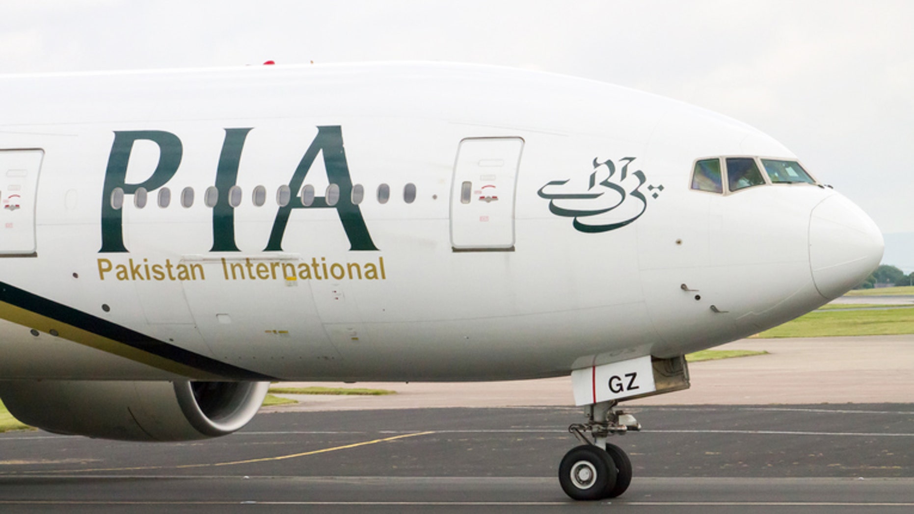 Manchester, United Kingdom - June 14, 2014: PIA Airlines Boeing 777 taxiing, Manchester International Airport. Prime Minister of Pakistan, Mr. Muhammad Nawaz Sharif, has expressed resolve to make PIA World's leading airline.