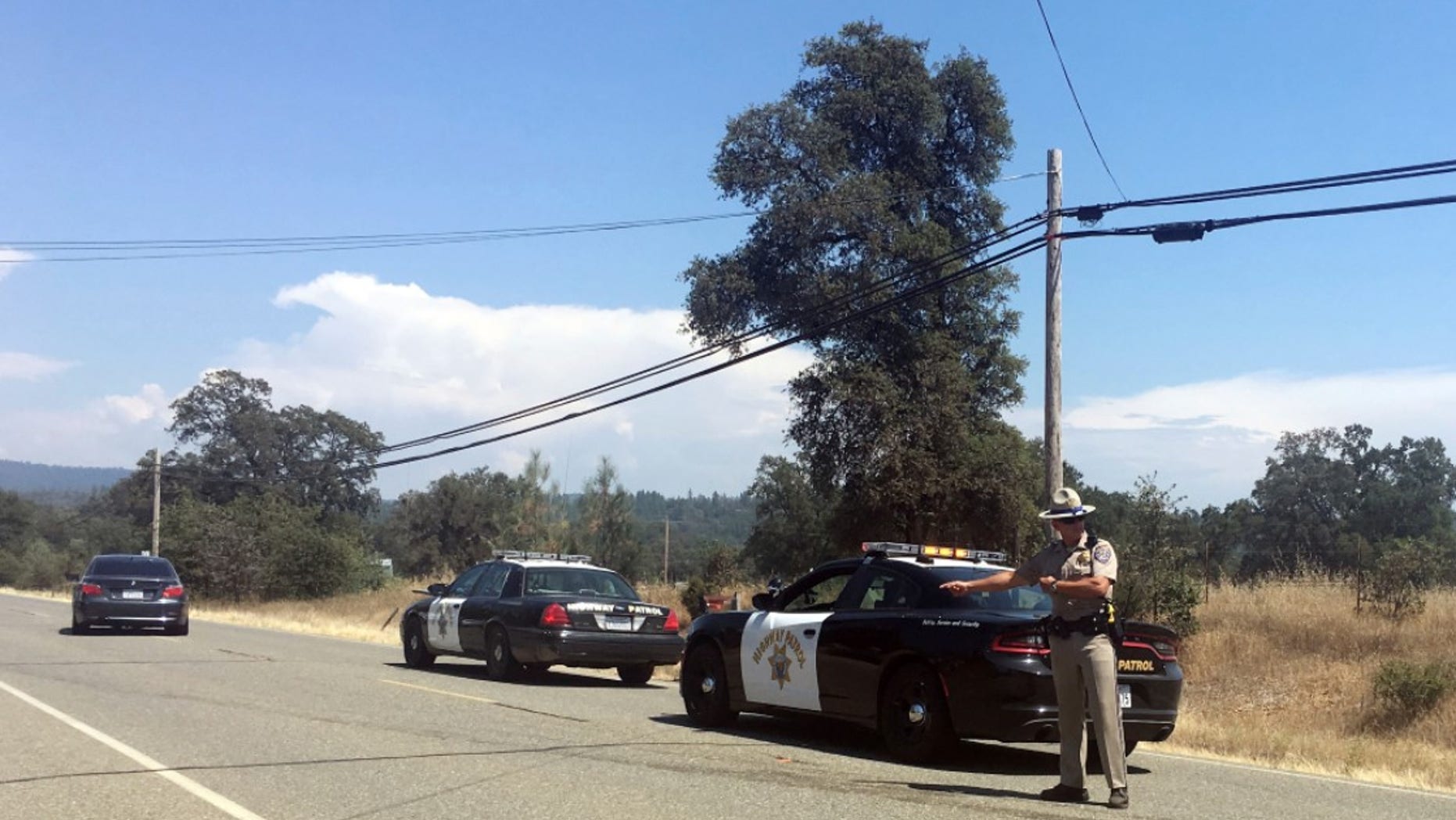 Two California sheriff's deputies were shot and wounded Tuesday after they responded to reports of an armed and agitated man pulling up plants in the garden of a rural Rastafarian church, authorities said. (AP Photo/Sophia Bollag)