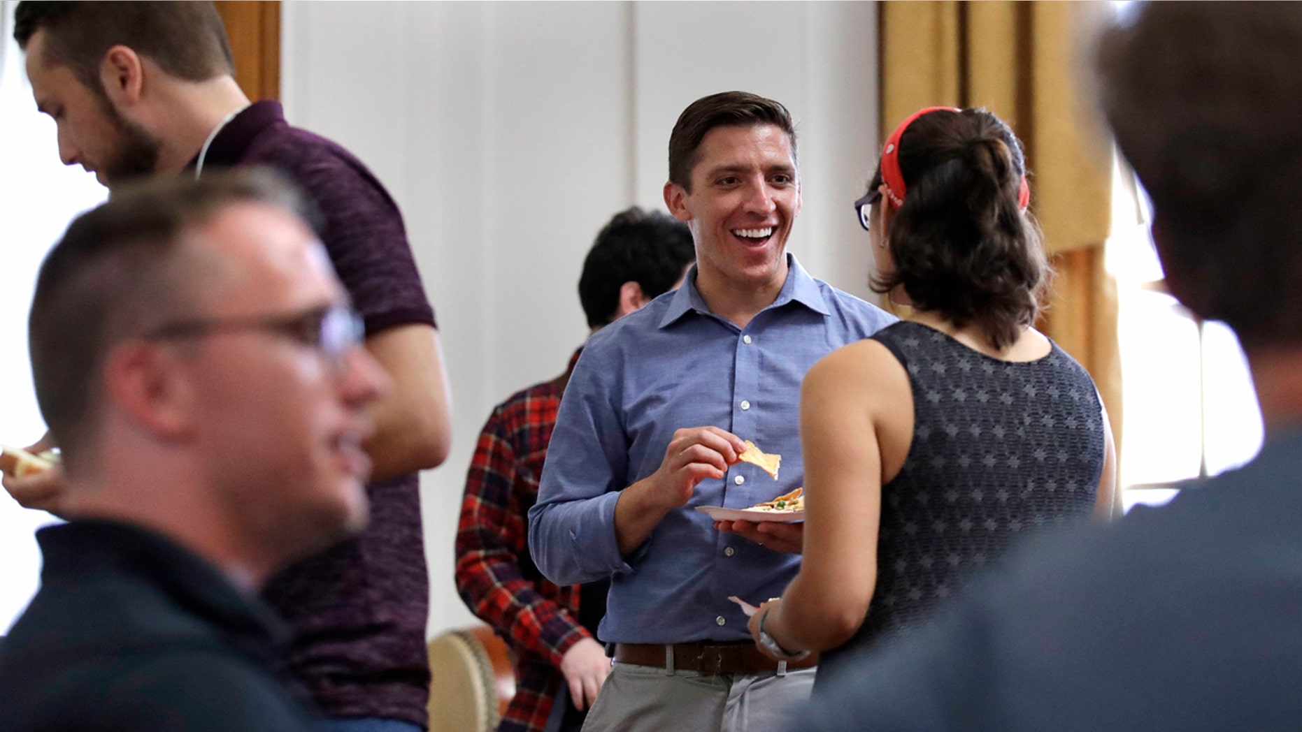 Zak Ringelstein, center, a Democratic candidate for U.S. Senate in Maine, now identifies with the DSA.