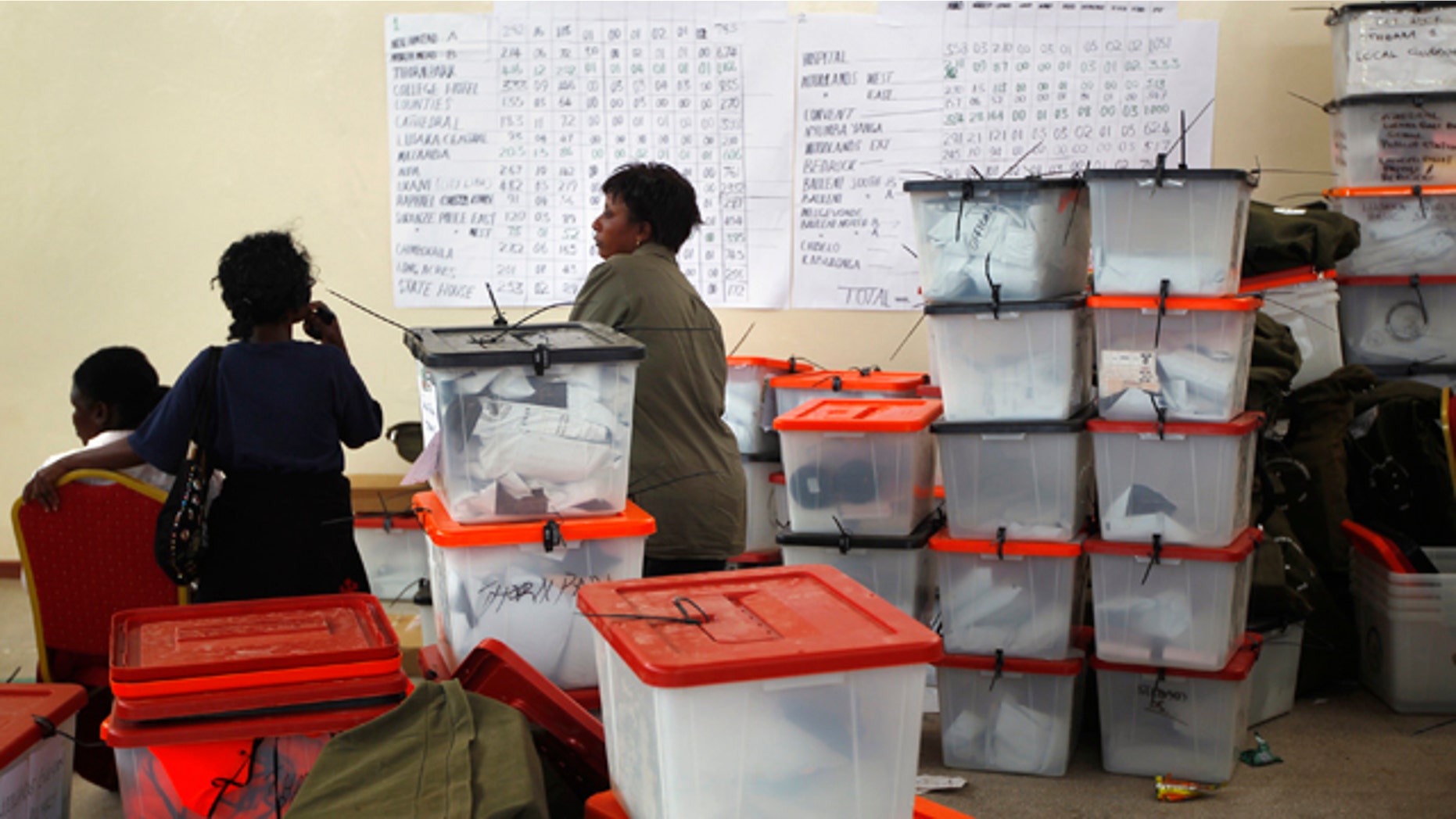 Sept. 22: Election volunteers stand by ballot boxes stored at the Civic Center in Lusaka, Zambia.