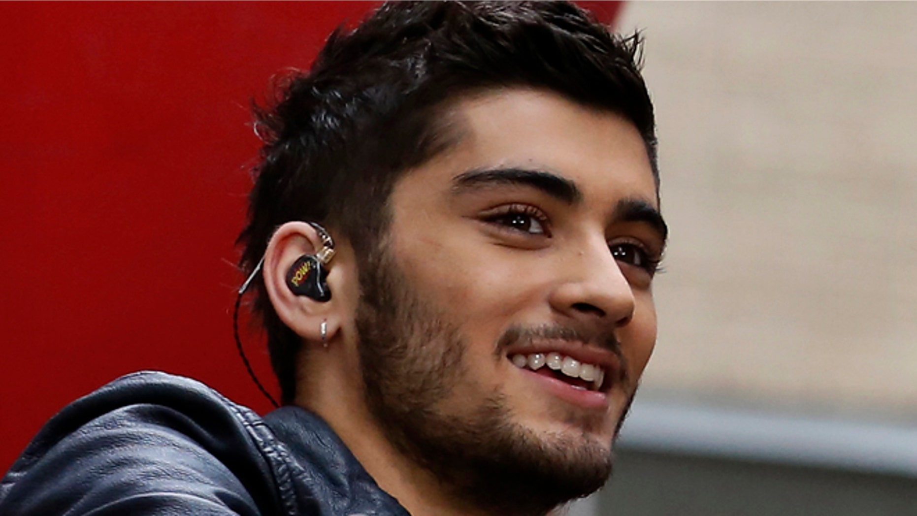 Zayn Malik (L) and Louis Tomlinson of One Direction appear on NBC's 'Today' show at Rockefeller Center in New York, August 23, 2013. REUTERS/Brendan McDermid (UNITED STATES - Tags: ENTERTAINMENT) - RTX12UH4