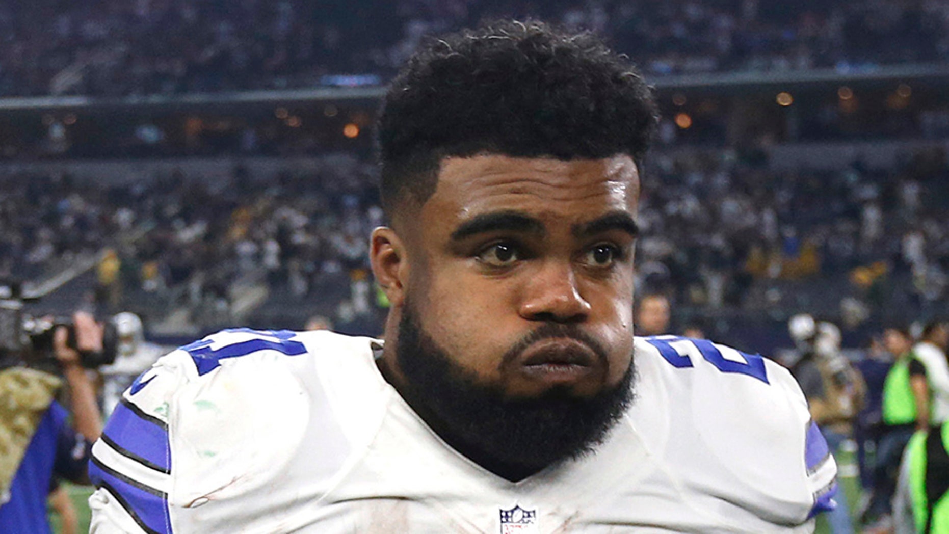 FILE - In this Jan. 15, 2017, file photo, Dallas Cowboys' Ezekiel Elliott (21) walks off the field after a 34-31 loss to the Green Bay Packers in an NFL divisional playoff football game, in Arlington, Texas. Cowboys owner Jerry Jones says the club is still gathering details over Elliott's involvement in an altercation at a Dallas bar, the latest off-field incident for the star running back. (AP Photo/Michael Ainsworth, File)