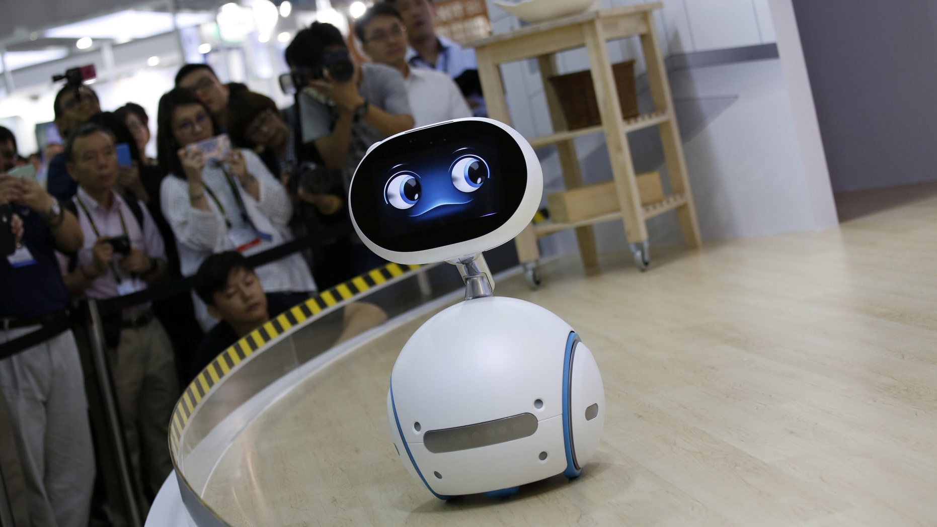 Taiwanese electronics manufacturer ASUS's Zenbo home robot demonstrates during the annual Computex computer exhibition in Taipei, Taiwan June 1, 2016. (REUTERS/Tyrone Siu)