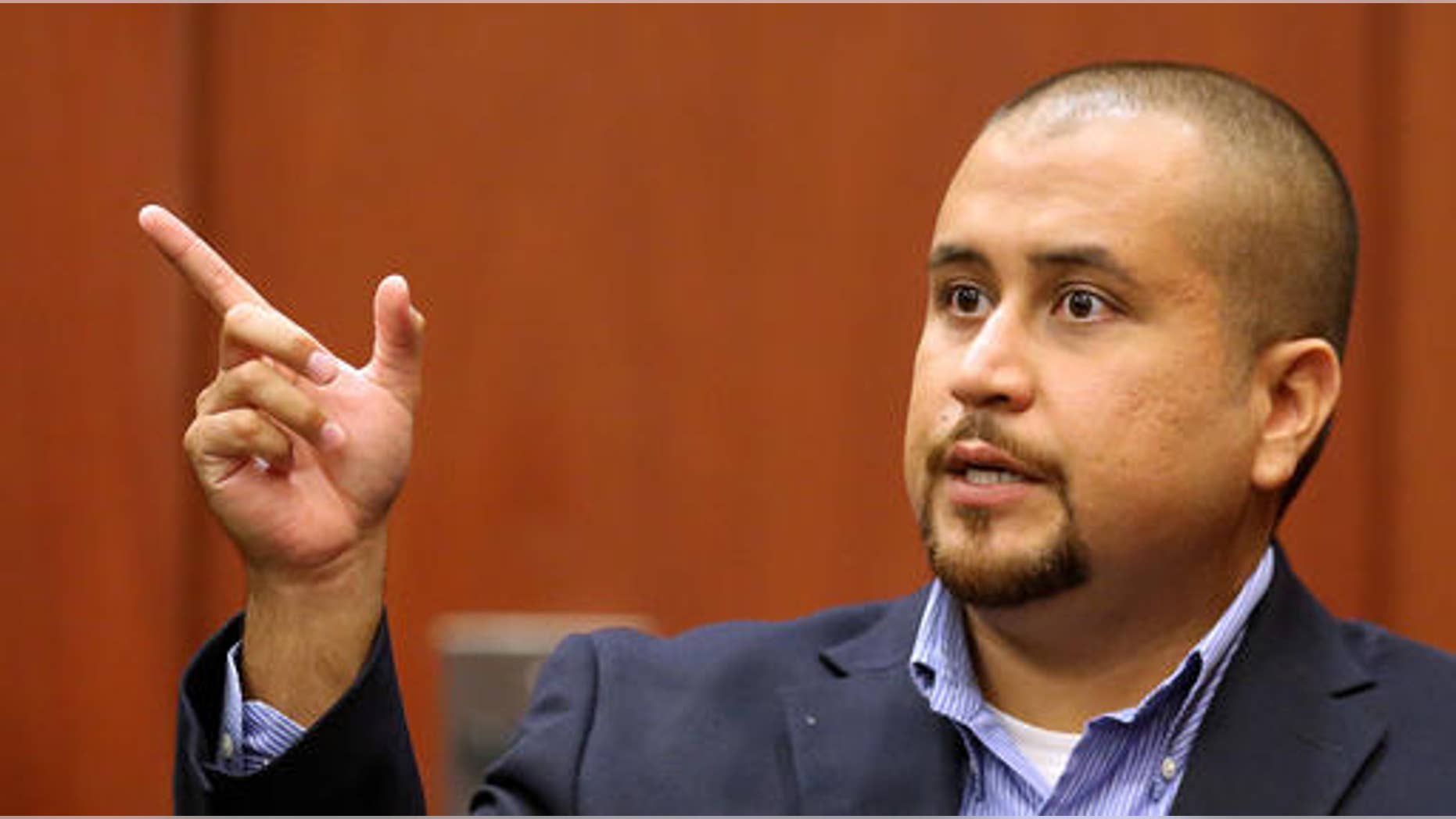 FILE - In this Sept. 22, 2015 file photo, George Zimmerman gestures during his testimony at a hearing for accused shooter Matthew Apperson in Seminole circuit court in Sanford, Fla. Testimony begins Tuesday, Sept. 13, 2016 in Apperson's attempted second-degree murder trial. Authorities say he shot at Zimmerman during a traffic incident last year. (Joe Burbank/Orlando Sentinel via AP, Pool)