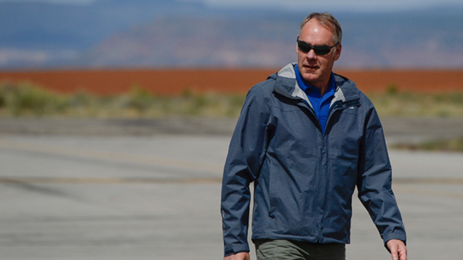 Interior Secretary Ryan Zinke arrives at the Blanding airport on Monday, May 8, 2017, for an aerial tour of the recently designated Bears Ears National Monument in southeastern Utah by President Barack Obama on Dec. 28, 2016. Utah Republicans in Congress are advocating for Trump to jettison Utah's national monument designation. (Francisco Kjolseth/The Salt Lake Tribune via AP)