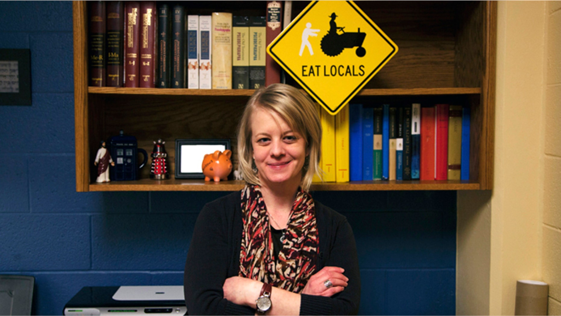 Jan. 23, 2014: In a photo provided by Central Michigan University Kelly Murphy, a philosophy and religion faculty member at Central Michigan University, stands in her office in Mount Pleasant, Mich. She is teaching a religion course this semester titled "From Revelation to 'The Walking Dead'" that explores biblical texts and apocalyptic themes in media. (AP/Christina Kurtz)