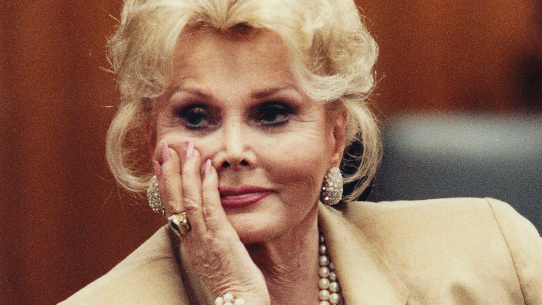 Zsa Zsa Gabor listens in court in Beverly Hills in this May 1, 1990 file photograph. REUTERS