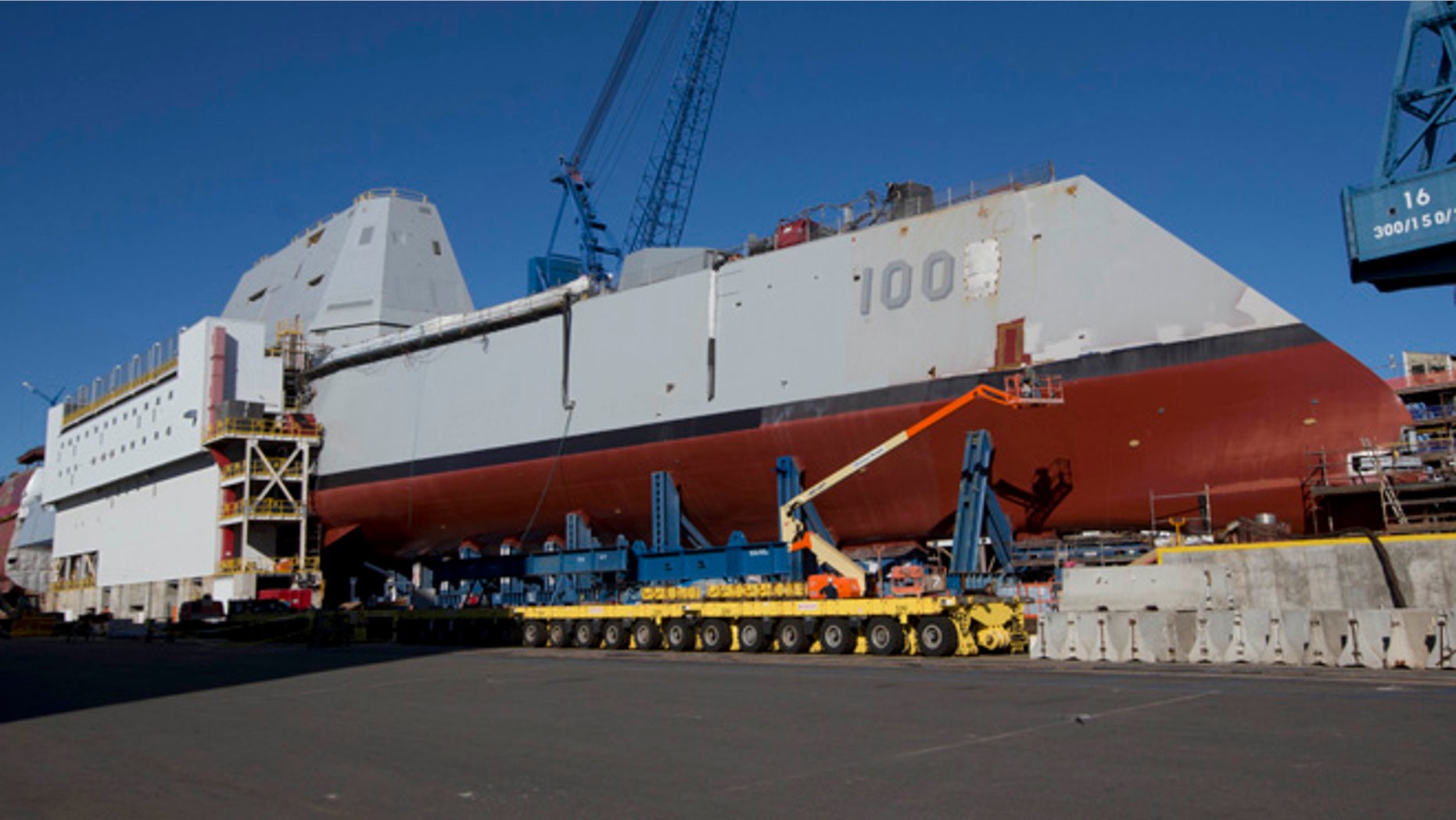 In this photo made Tuesday, Oct. 8, 2013, the first-in-class Zumwalt, the largest U.S. Navy destroyer ever built, is seen at Bath Iron Works in Bath, Maine. The christening of the Zumwalt was canceled once because of the government shutdown. But plans call for the ship to be moved to dry dock in Maine and floated without fanfare in the coming days.