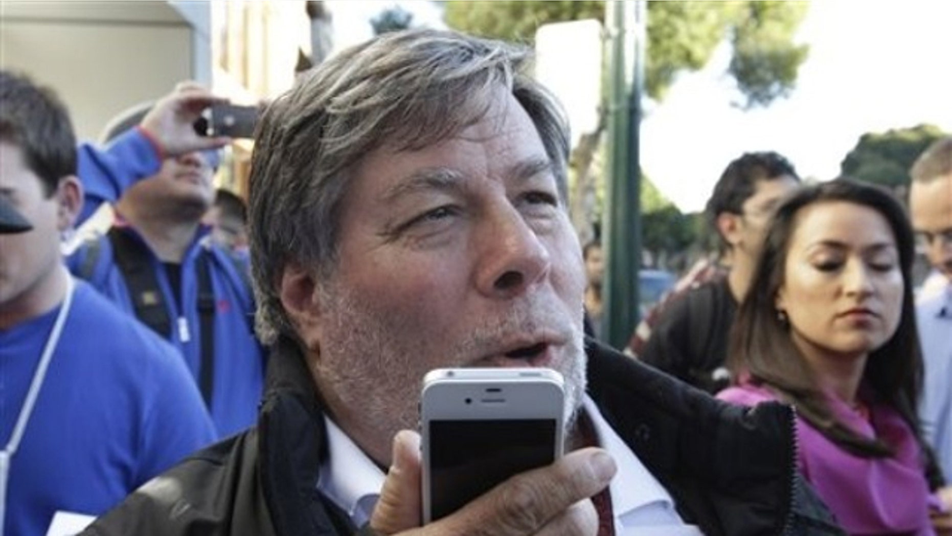 Apple co-founder Steve Wozniak tests out Siri on the iPhone 4S.