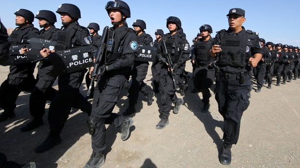 Chinese soldiers participate in an anti-terror drill in Hami, Xinjiang Uighur Autonomous Region, China, July 8, 2017.