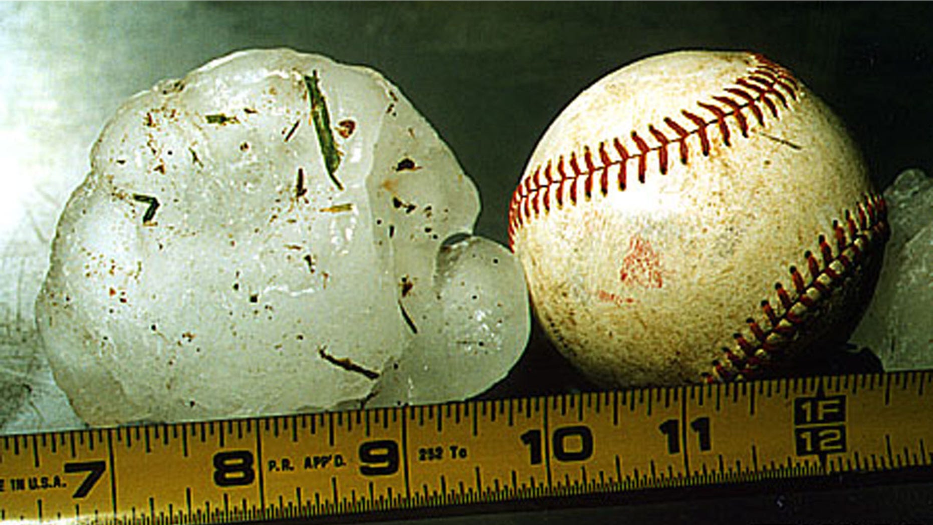 An Australian woman suffered severe bruises while protecting her baby from softball-sized hailstones on Thursday.
