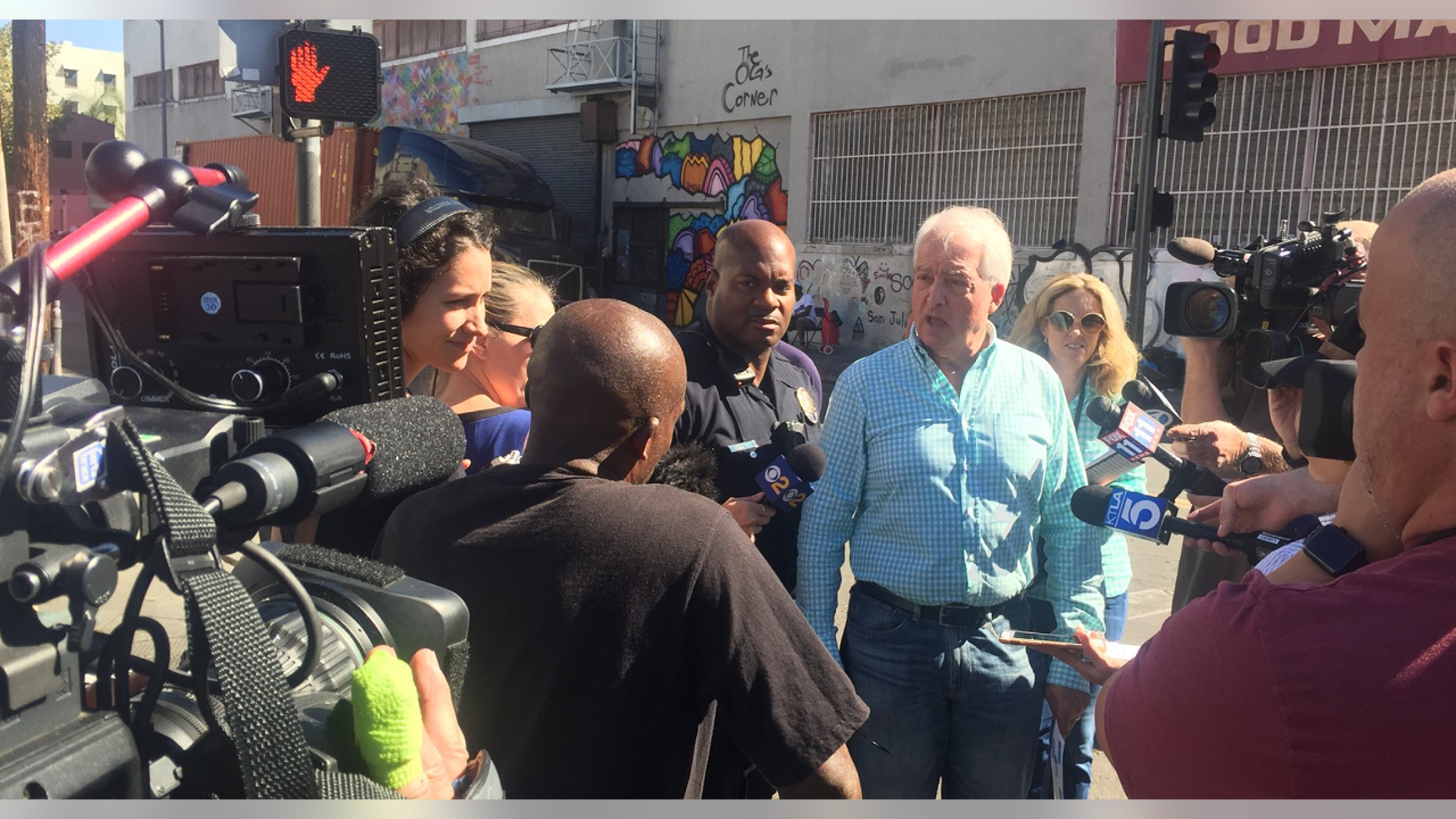 Republican gubernatorial candidate, fourth from right, talking to reporters while touring Los Angeles’ skid row on Tuesday.