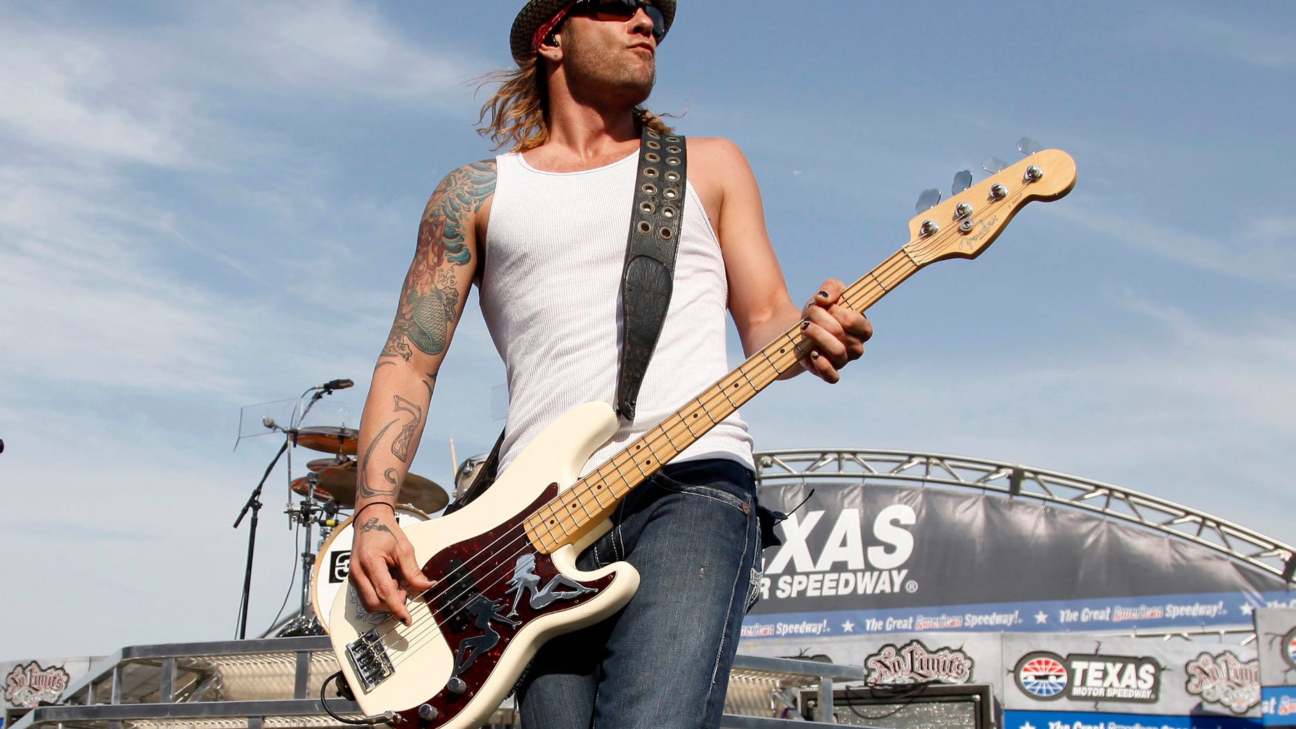FILE - In this April 9, 2011 file photo, 3 Doors Down' bassist Todd Harrell performs before a NASCAR auto race at Texas Motor Speedway in Fort Worth, Texas. Harrell, the founding member and former bassist of the rock band 3 Doors Down has been sentenced to 10 years in Mississippi state prison for possession of a firearm by a felon. News outlets report Jackson County Circuit Court Judge Robert Krebs gave Todd Harrell the maximum penalty during a hearing Thursday, Oct. 11, 2018.