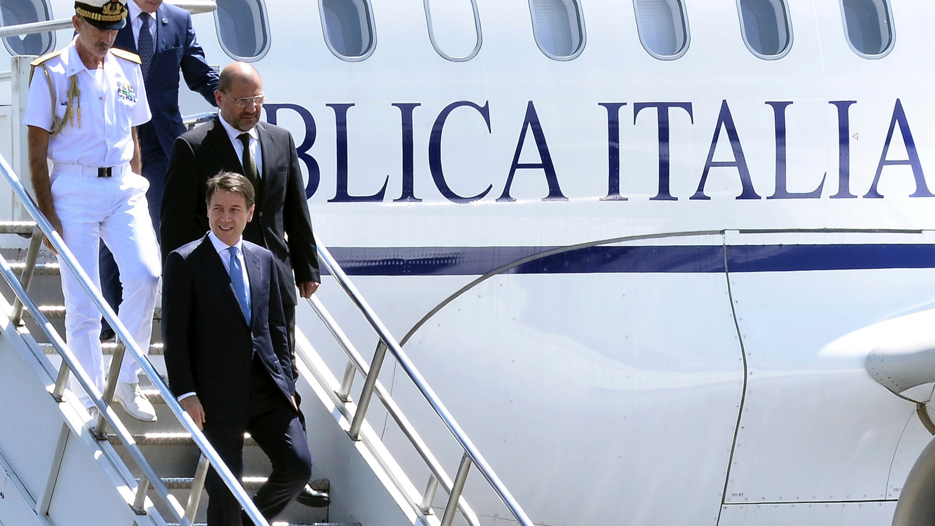 Italy's Prime Minister Giuseppe Conte, foreground, arrives at the airport in Addis Ababa, Ethiopia Thursday, Oct. 11, 2018 for a bilateral visit to the country. The two parties will have bilateral discussions on trade, investment, and other matters according to Ethiopia's Prime Minister's office. (AP Photo)