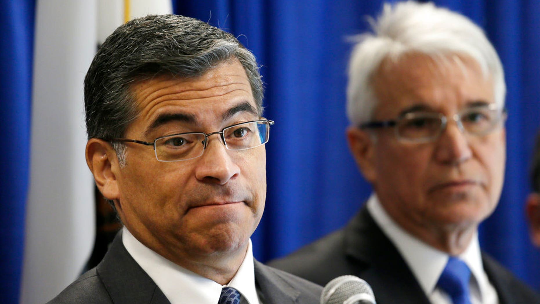 California Attorney General Xavier Becerra, left, with San Francisco District Attorney George Gascon, during a news conference.