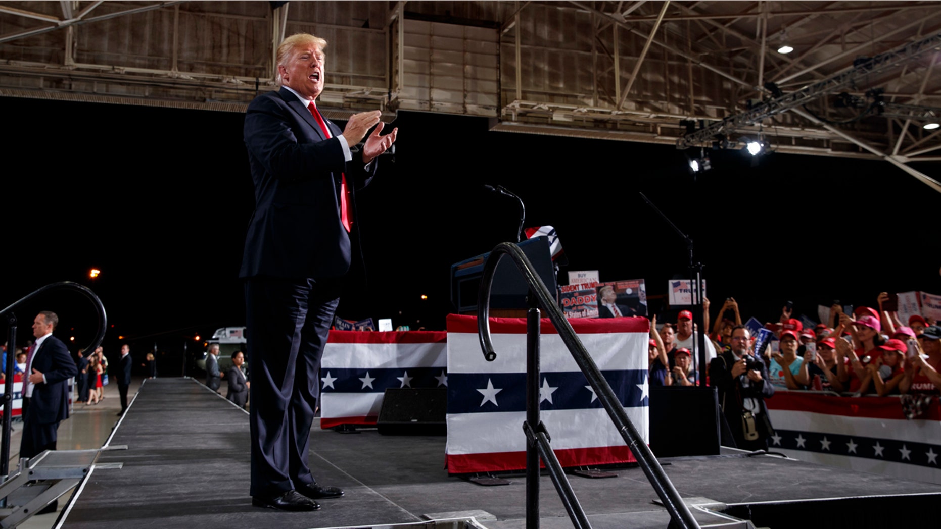 President Donald Trump calls out as he leaves the stage after speaking at a campaign rally at International Air Response, Friday, Oct. 19, 2018, in Mesa, Ariz.