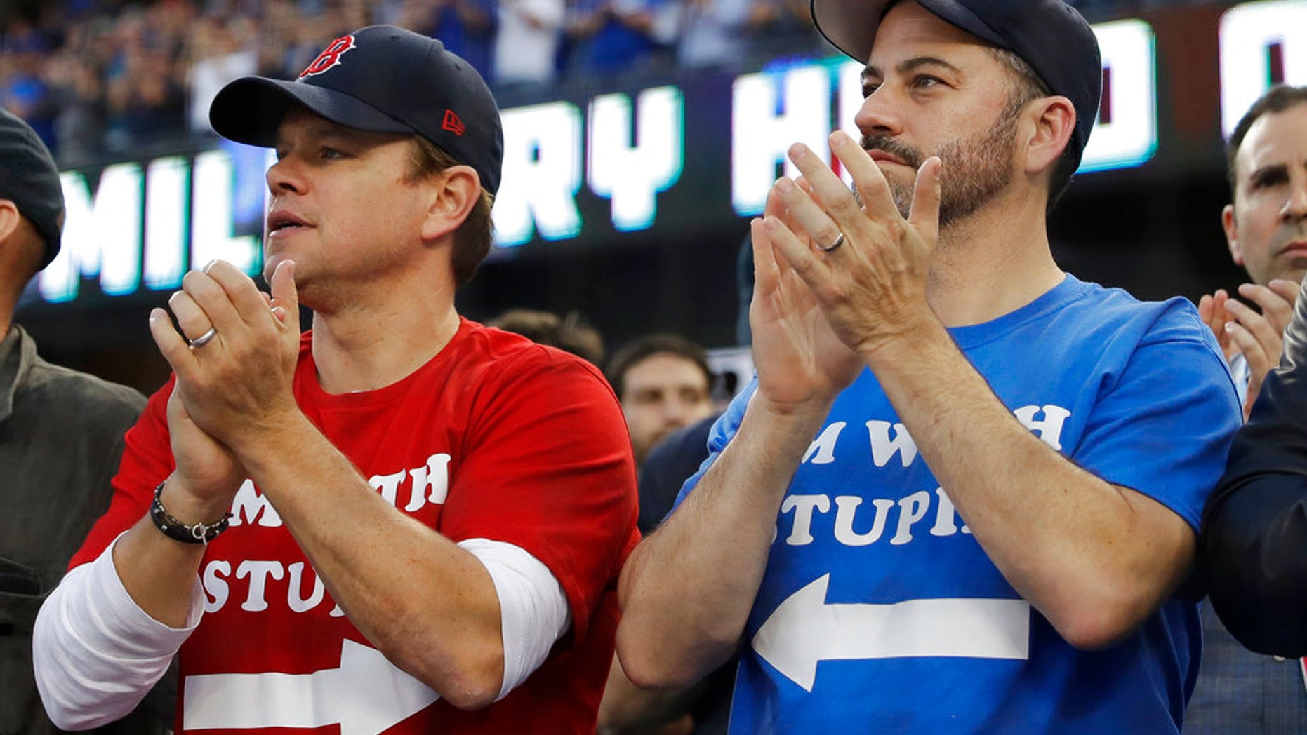 Matt Damon and Jimmy Kimmel watch Game 5 of the World Series baseball game between the Boston Red Sox and Los Angeles Dodgers on Sunday.