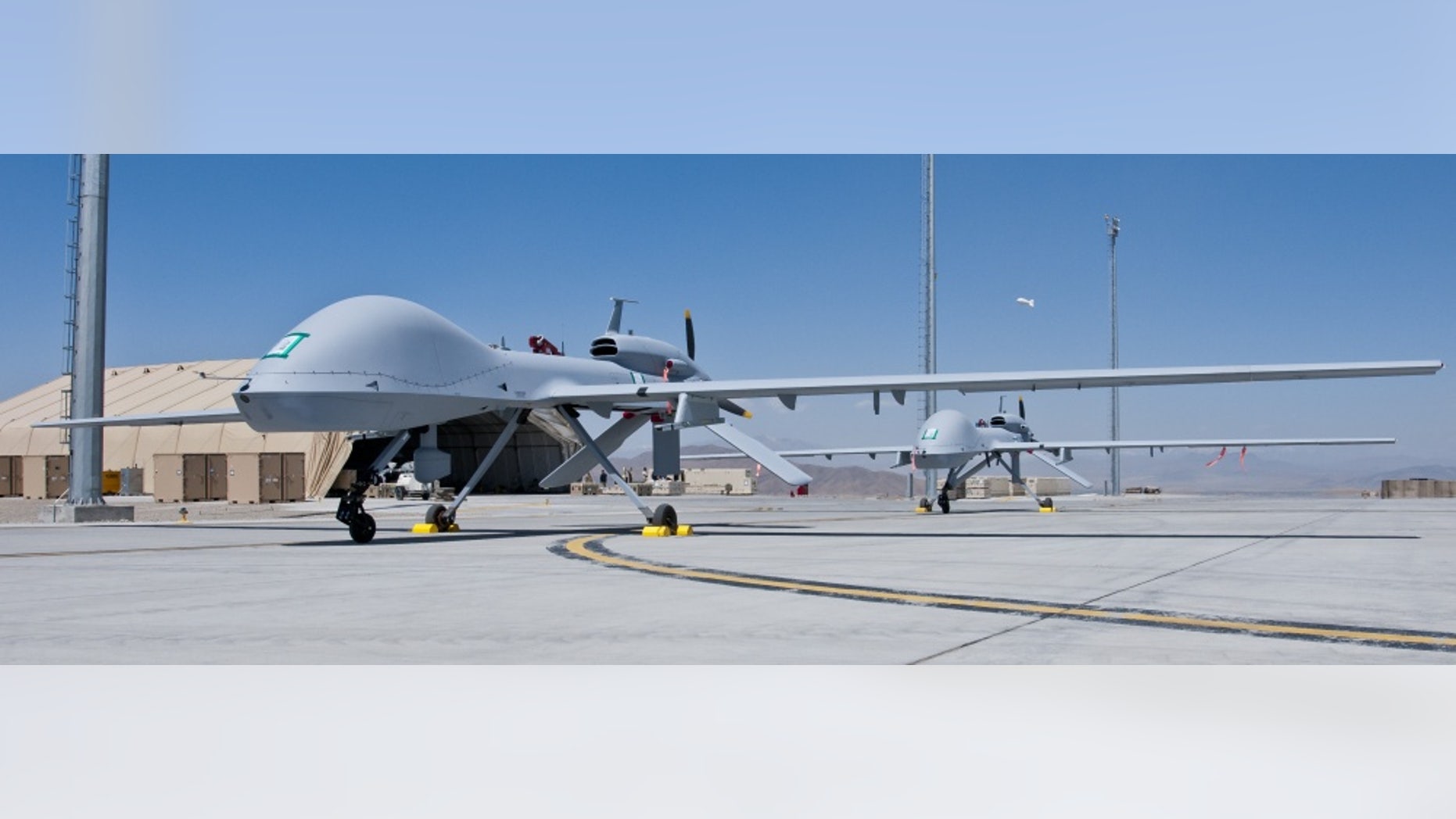 File photo - Two freshly assembled Grey Eagle unmanned aerial vehicles sit on the tarmac at Forward Operating Base Shank April 12. 2012.