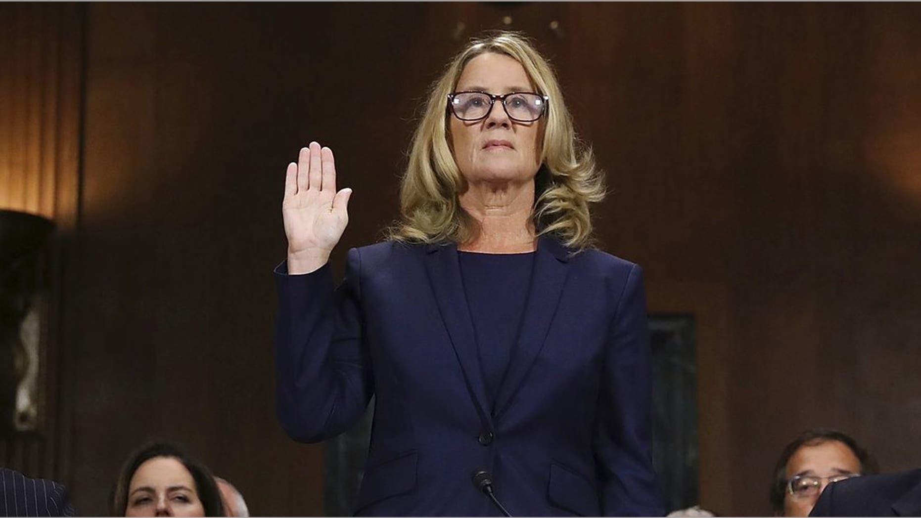 Christine Blasey Ford is sworn in before the Senate Judiciary Committee on Capitol Hill in Washington on Thursday, Sept. 27, 2018. (Win McNamee/Pool Photo via AP)
