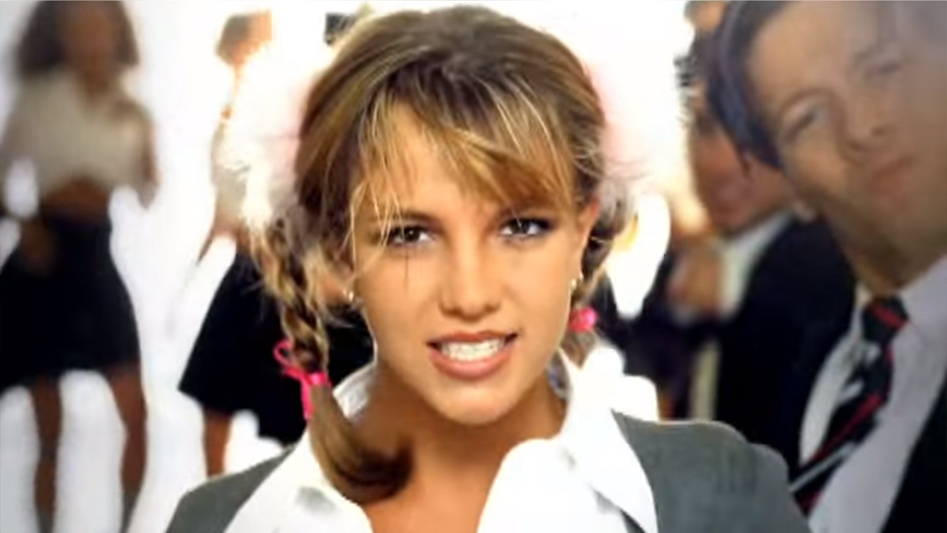 Britney Spears celebrated the 20th anniversary of her debut single "...Baby One More Time" on Tuesday. The singer is pictured here in the music video for her hit, which was released in 1998.