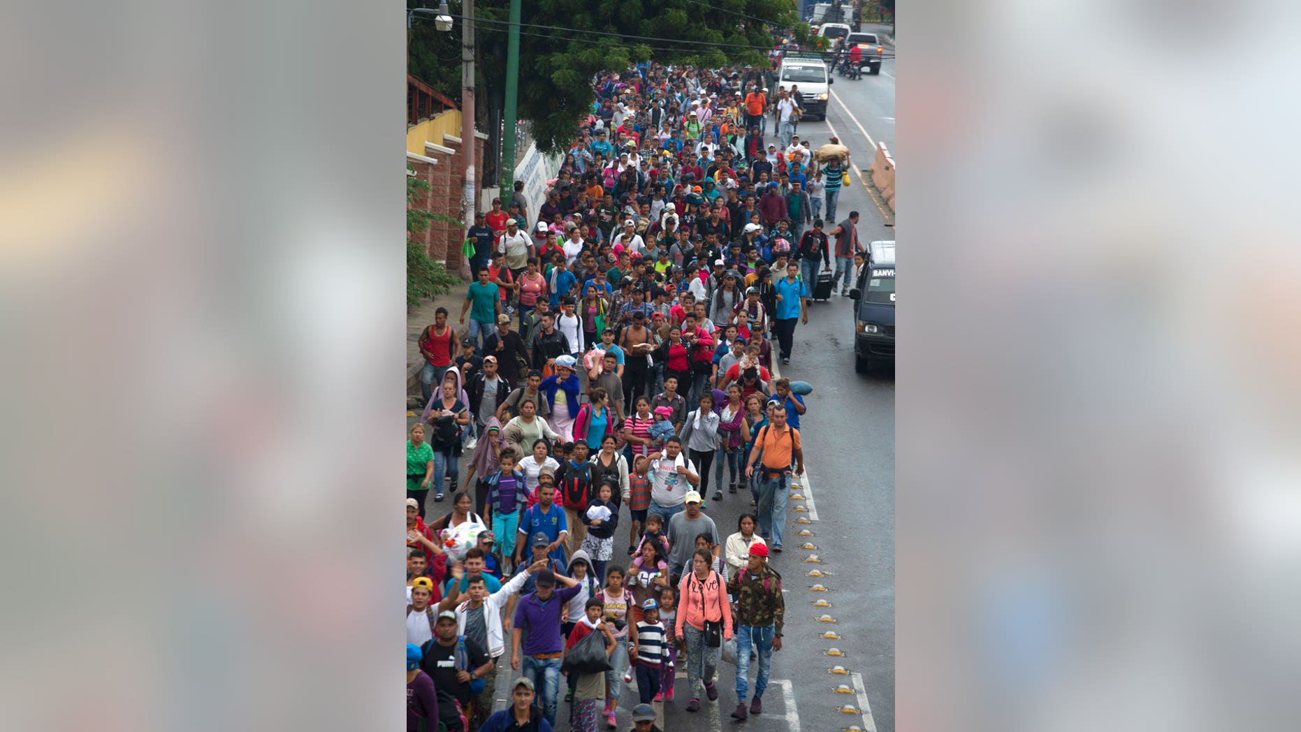 Honduran migrants walking to the U.S. start their day departing Chiquimula, Guatemala. (AP Photo/Moises Castillo)