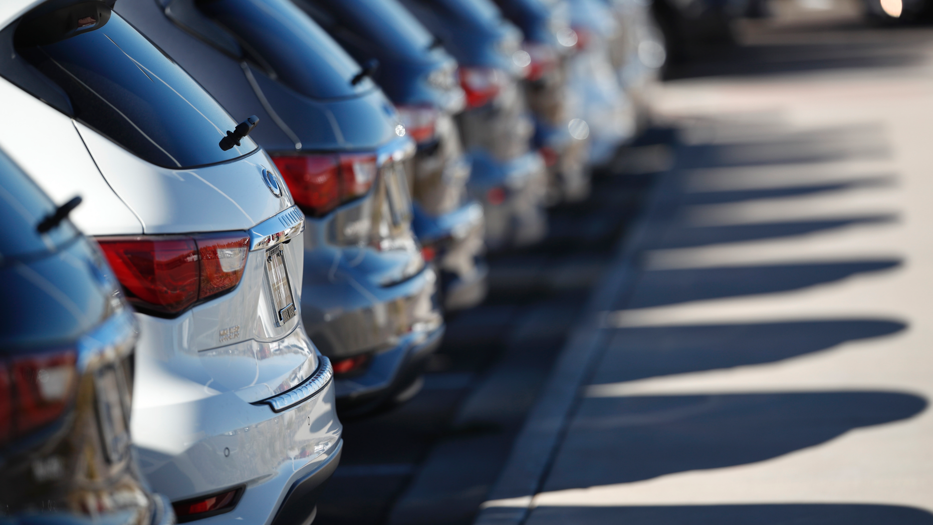 In this Oct. 21, 2018, photo a long line of unsold 2018 QX60 sports utility vehicles cast long shadows at an Infiniti dealership in Highlands Ranch, Colo. On Monday, Oct. 29, the Commerce Department issues its September report on consumer spending, which accounts for roughly 70 percent of U.S. economic activity. (AP Photo/David Zalubowski)