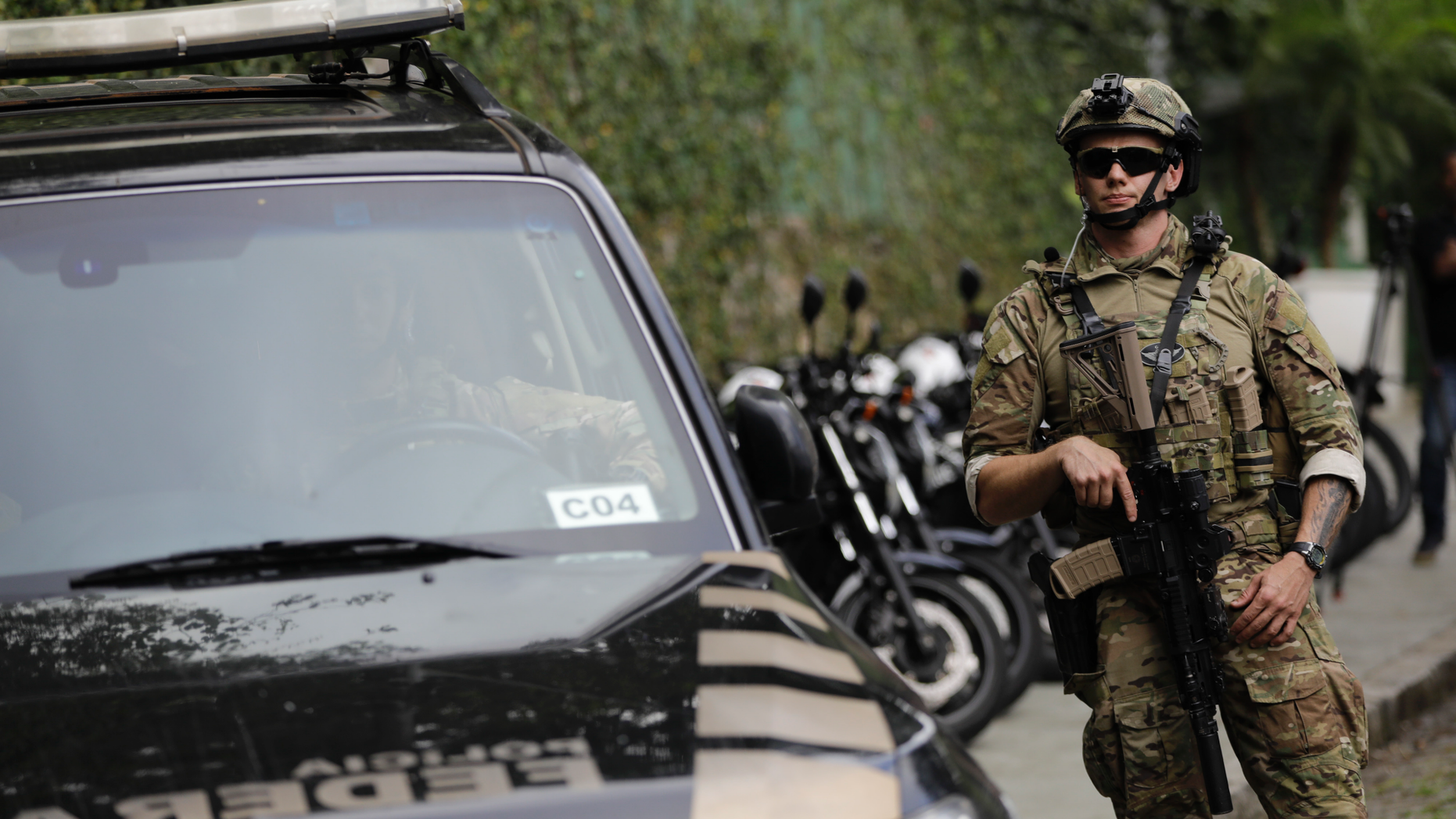 A federal police officer standing guard in Rio de Janeiro, in October 2018. The city is set to try "license to kill" policing next year, according to a report. (AP Photo/Leo Correa, File)