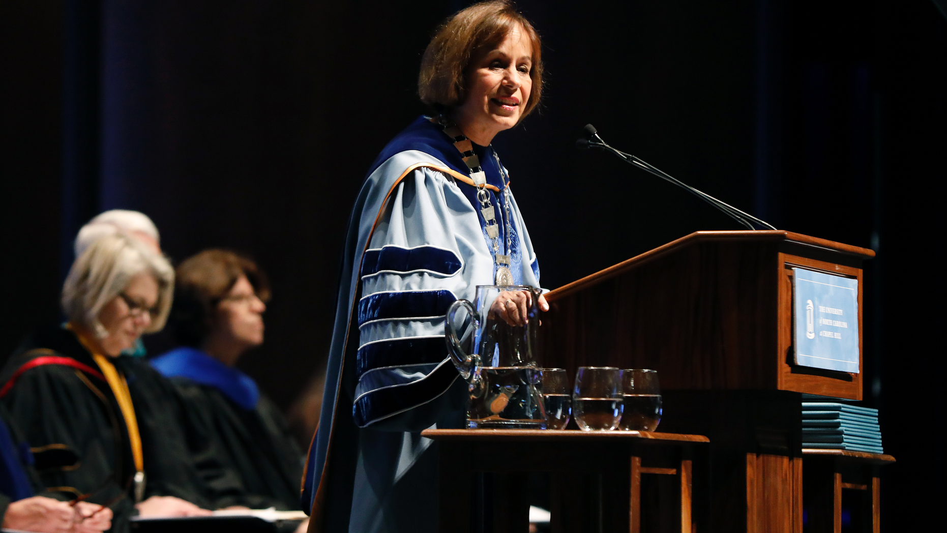UNC Chapel Hill Chancellor Carol Folt speaks during University Day at Memorial Hall, Friday, Oct. 12, 2018 in Chapel Hill, N.C. Folt apologized Friday for the school's history of slavery, adding that words alone are not enough to atone for using enslaved people to build and maintain the campus. (Ethan Hyman/The News & Observer via AP)