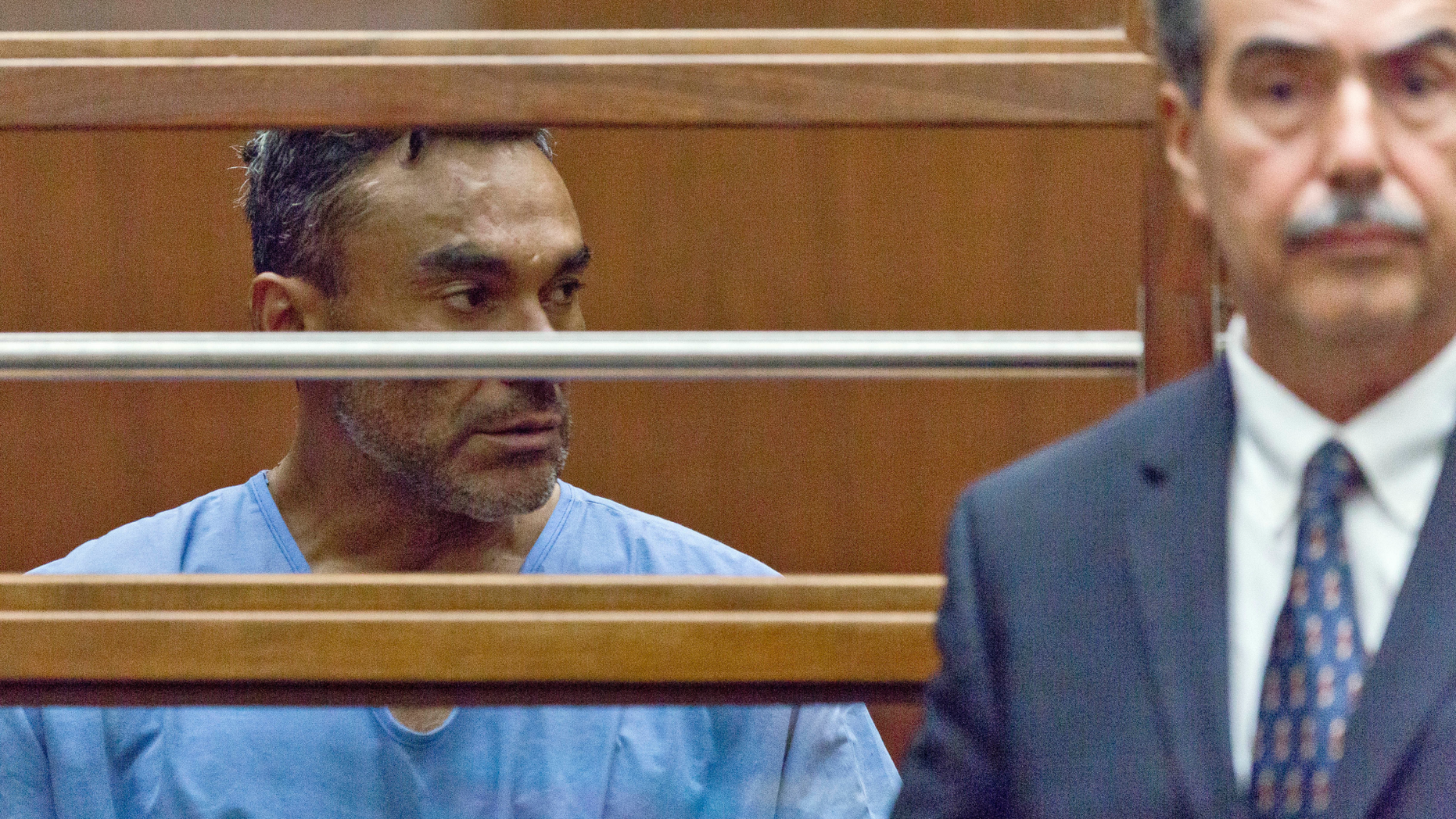 FILE - In this Sept. 26, 2018, file photo, Ramon Escobar, with an unidentified attorney, appears at a hearing in Los Angeles County Superior Court. Police will seek a fourth murder charge against Escobar, suspected in a string of brutal and deadly beatings in the Los Angeles area, after another victim died, officials said Wednesday, Oct. 3. (AP Photo Damian Dovarganes, File)
