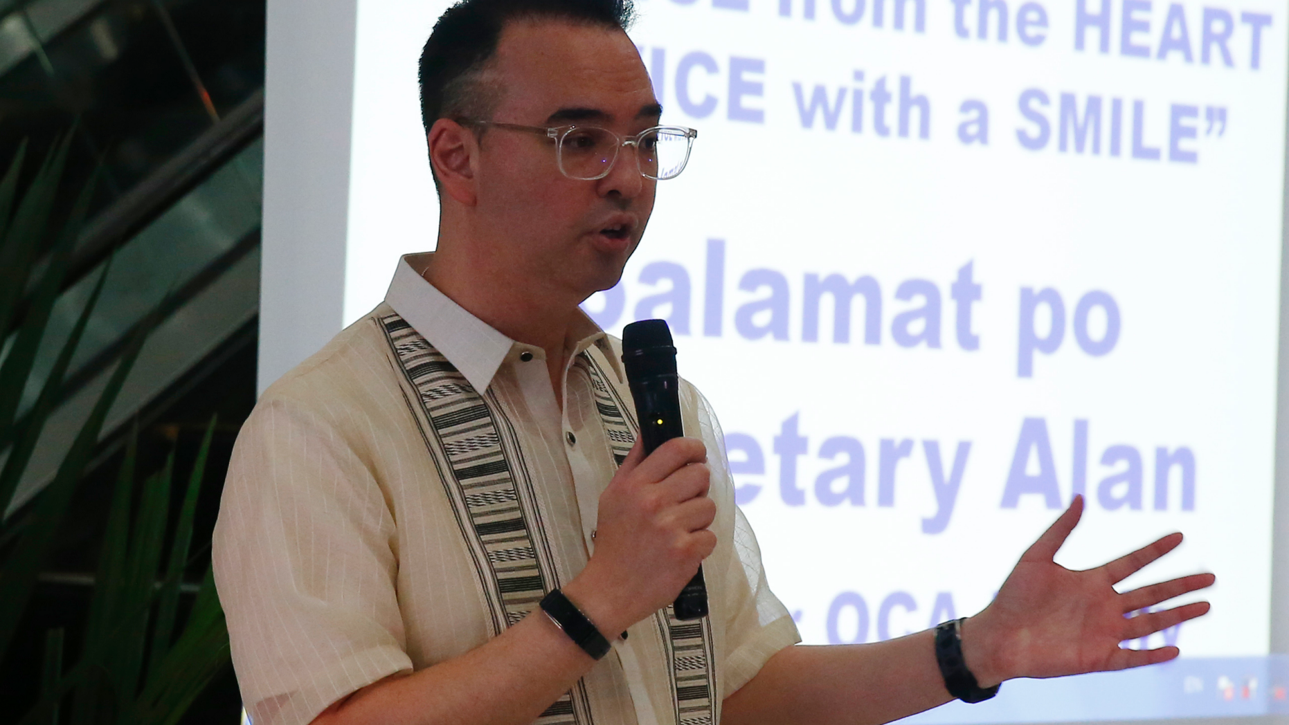 Outgoing Philippine Foreign Affairs Secretary Alan Peter Cayetano talks to the media as he bids farewell to his staff during the lowering of the flag ceremony Friday, Oct. 12, 2018 in suburban Pasay city south of Manila, Philippines. Cayetano, who resigned this week to run for a seat in the Philippine Congress for next year's mid-term elections, confirmed in a news conference Friday that President Rodrigo Duterte and Vietnamese Prime Minister Nguyen Xuan Phuc, in a meeting in Indonesia, discussed efforts by their countries to delineate their maritime boundaries in the disputed South China Sea, most of which is claimed by China. (AP Photo/Bullit Marquez)