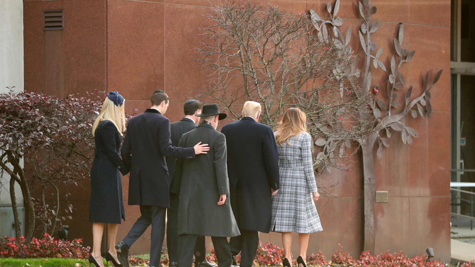 President Donald Trump and first lady Melania Trump walk into Pittsburgh's Tree of Life Synagogue in Pittsburgh, Tuesday, Oct. 30, 2018, with Ivanka Trump, back left, and Jared Kushner and Tree of Life Rabbi Jeffrey Myers, back right, and Ron Dermer, Israel's ambassador to the United States. (AP Photo/Andrew Harnik)