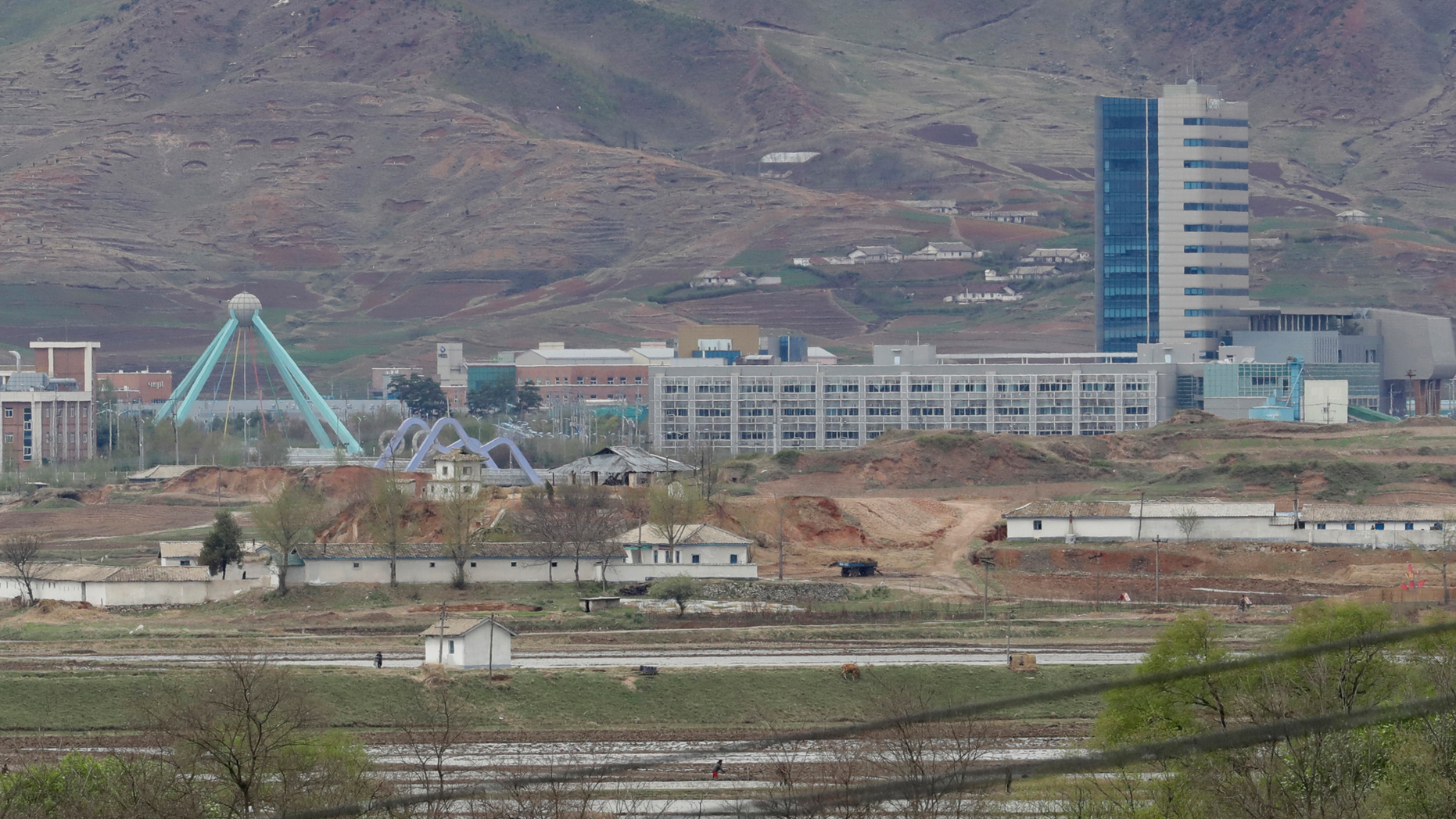 FILE - In this April 24, 2018, file photo, the Kaesong industrial complex in North Korea is seen from the Taesungdong freedom village inside the demilitarized zone during a press tour in Paju, South Korea. South Korea's Unification Ministry on Wednesday, Oct. 10, 2018, said the water is being supplied to a liaison office between the countries that opened in Kaesong in September 2018 and has been provided to the town's residents as well. (AP Photo/Lee Jin-man, File)