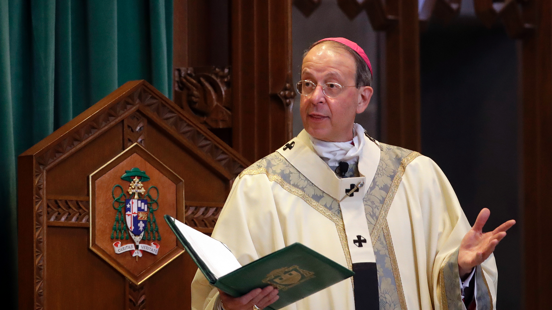 In this March 28, 2017 photo Archbishop William Lori leads a funeral Mass for Cardinal William Keeler at the Cathedral of Mary Our Queen in Baltimore. Lori, of the Diocese of Wheeling-Charleston, announced in a news release Wednesday, Oct. 24, 2018 he plans to release the names of all priests and deacons who have been “credibly accused” of child sexual abuse since 1950. (AP Photo/Patrick Semansky)