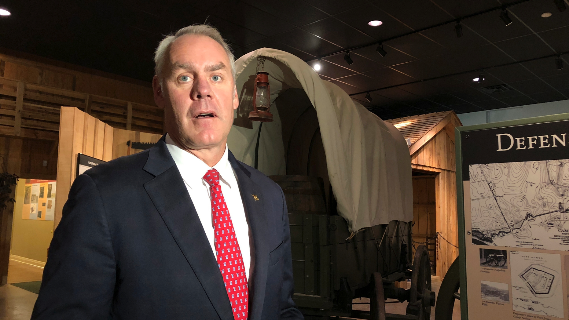 U.S. Interior Secretary Ryan Zinke speaks with reporters at the Camp Nelson National Monument on Saturday, Oct. 27, 2018, in Nicholasville, Kentucky. Camp Nelson was a Union Army depot during the U.S. Civil War and was a recruiting center for black soldiers. Zinke announced Saturday Camp Nelson has been officially designated as a national monument. (AP Photo/Adam Beam)
