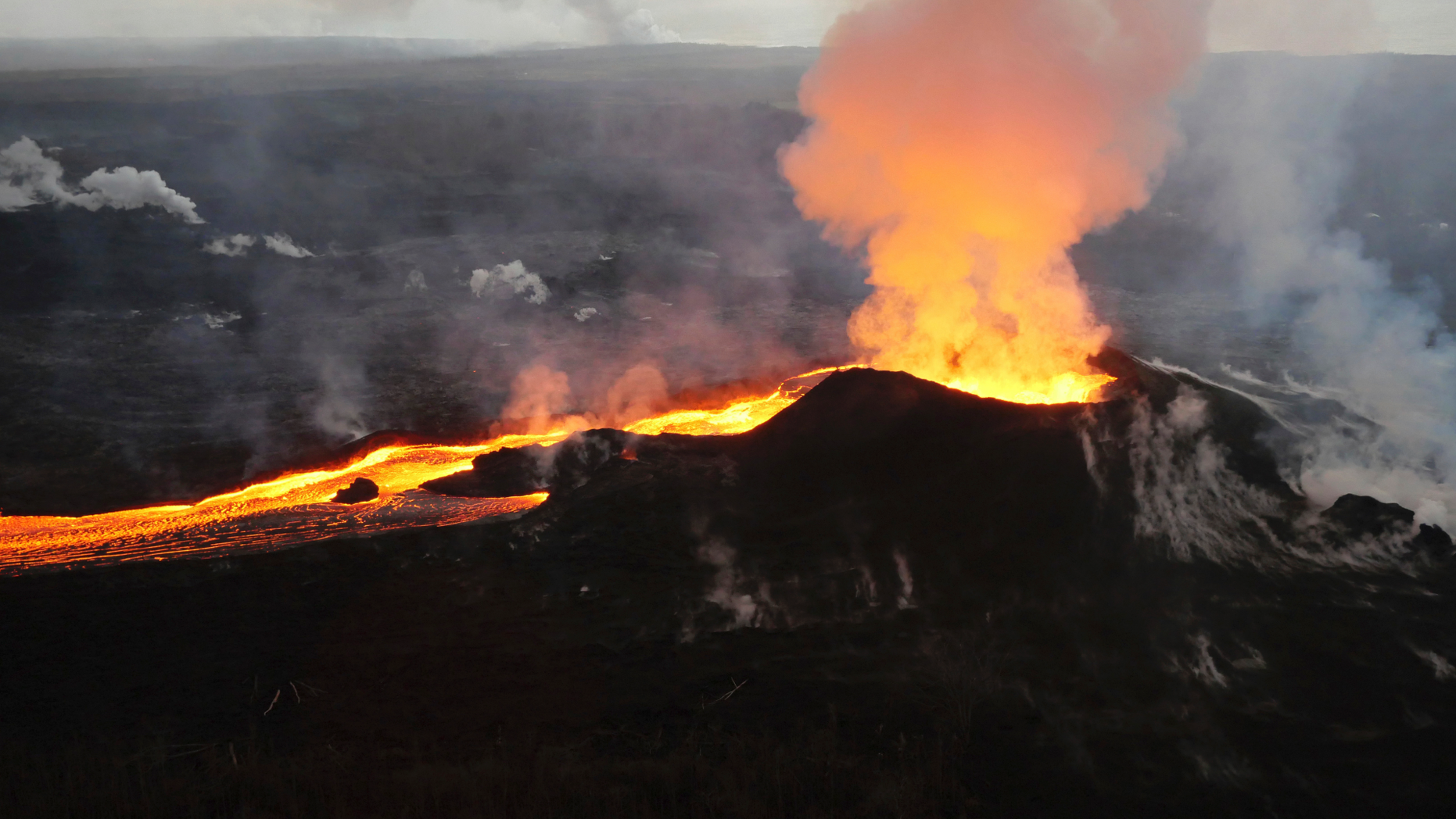 Lava from Kilauea volcano erupts in the Leilani Estates neighborhood near Pahoa, Hawaii, on July 14, 2018. (U.S. Geological Survey via AP)