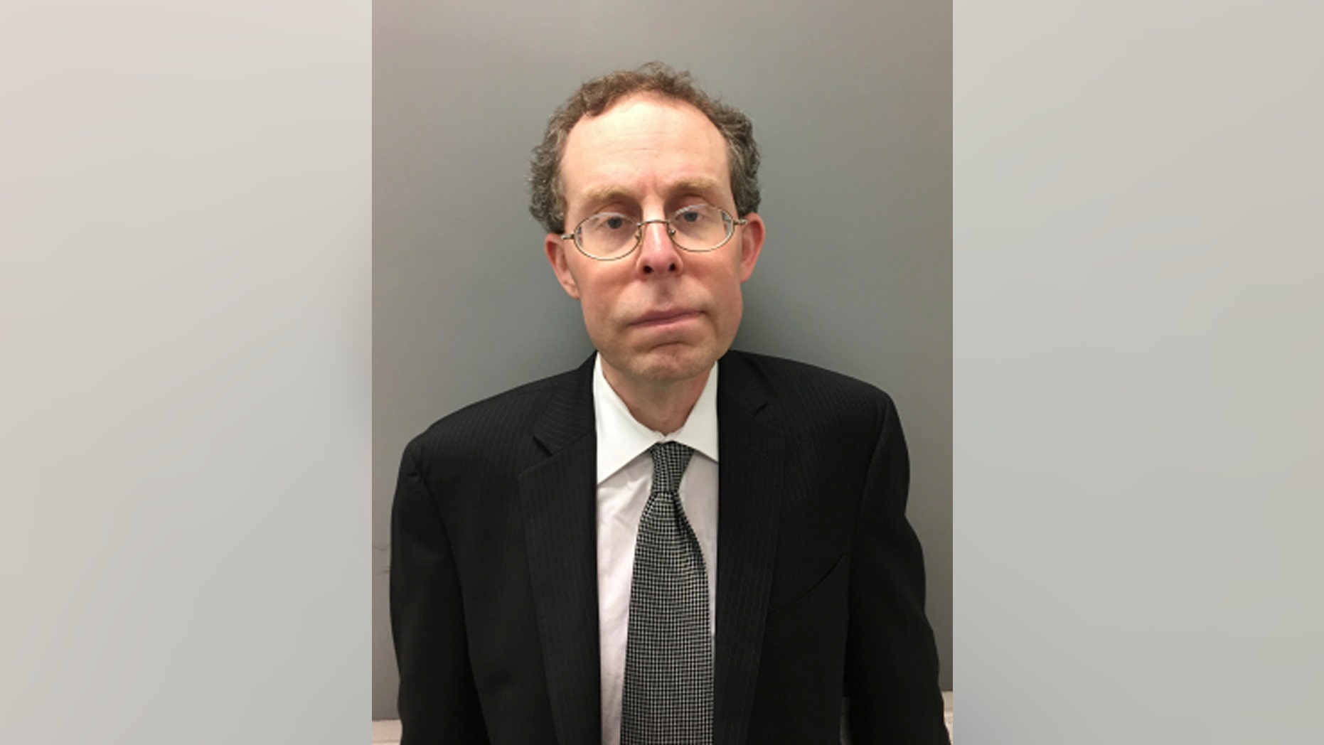 This undated photo released by the Bucks County (Pa.) District Attorney's Office shows Lawrence Weinstein, in Pa. Prosecutors say Weinstein, a former Pennsylvania township official, and his girlfriend, Kelly Drucker, spiked a woman’s drink and used a hidden camera to take sexually explicit photographs of her while she was unconscious. Weinstein and Drucker are charged with false imprisonment, invasion of privacy, recklessly endangering another person, criminal conspiracy and violations of the Pennsylvania Wiretap Act. They surrendered to Bucks County detectives Tuesday, Oct. 9, 2018. (Bucks County District Attorney's Office via AP)