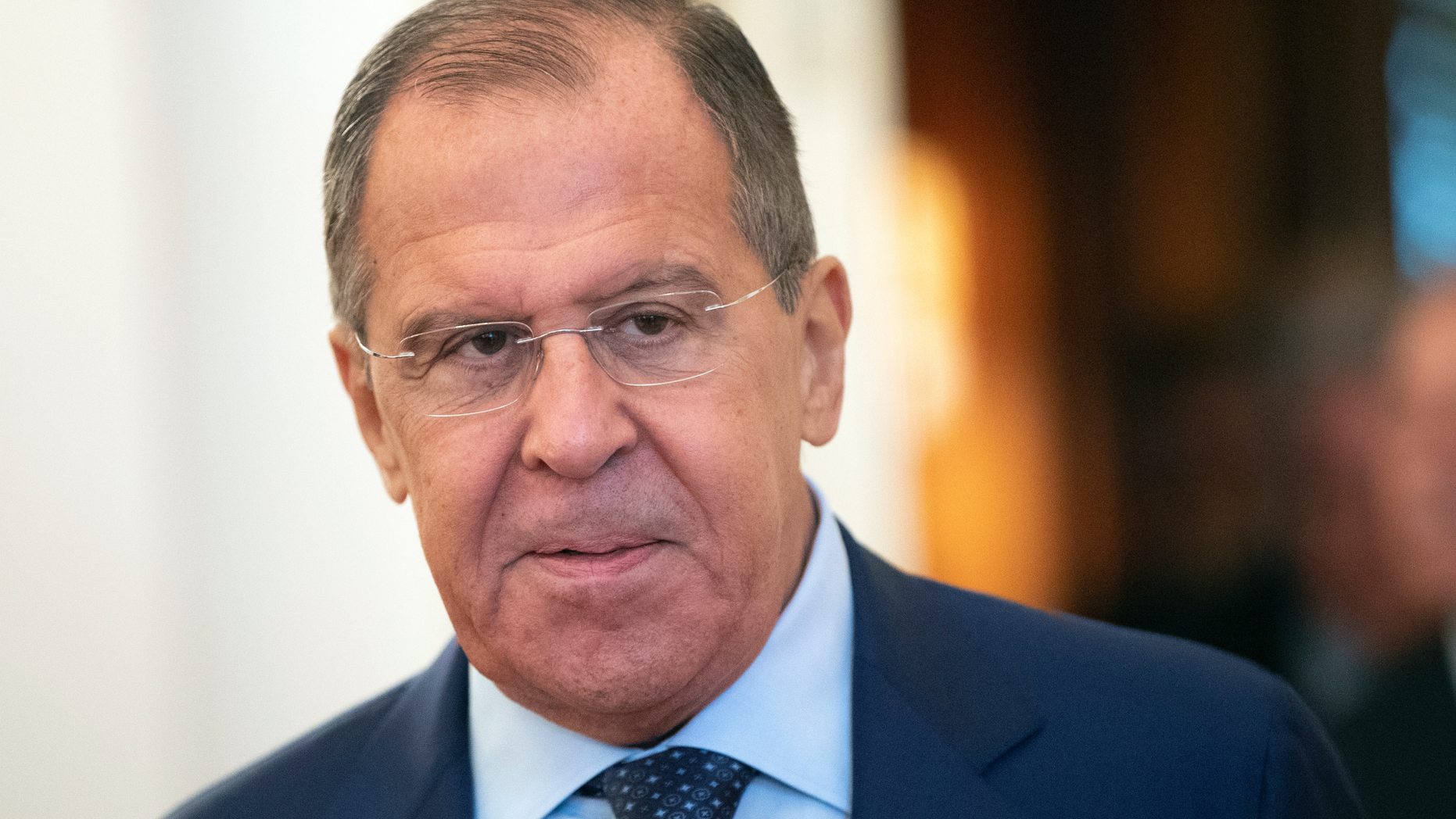 Russian Foreign Minister Sergey Lavrov enters a hall during his meeting with Italian Foreign Minister Enzo Moavero in Moscow, Russia, Monday, Oct. 8, 2018. (AP Photo/Pavel Golovkin)
