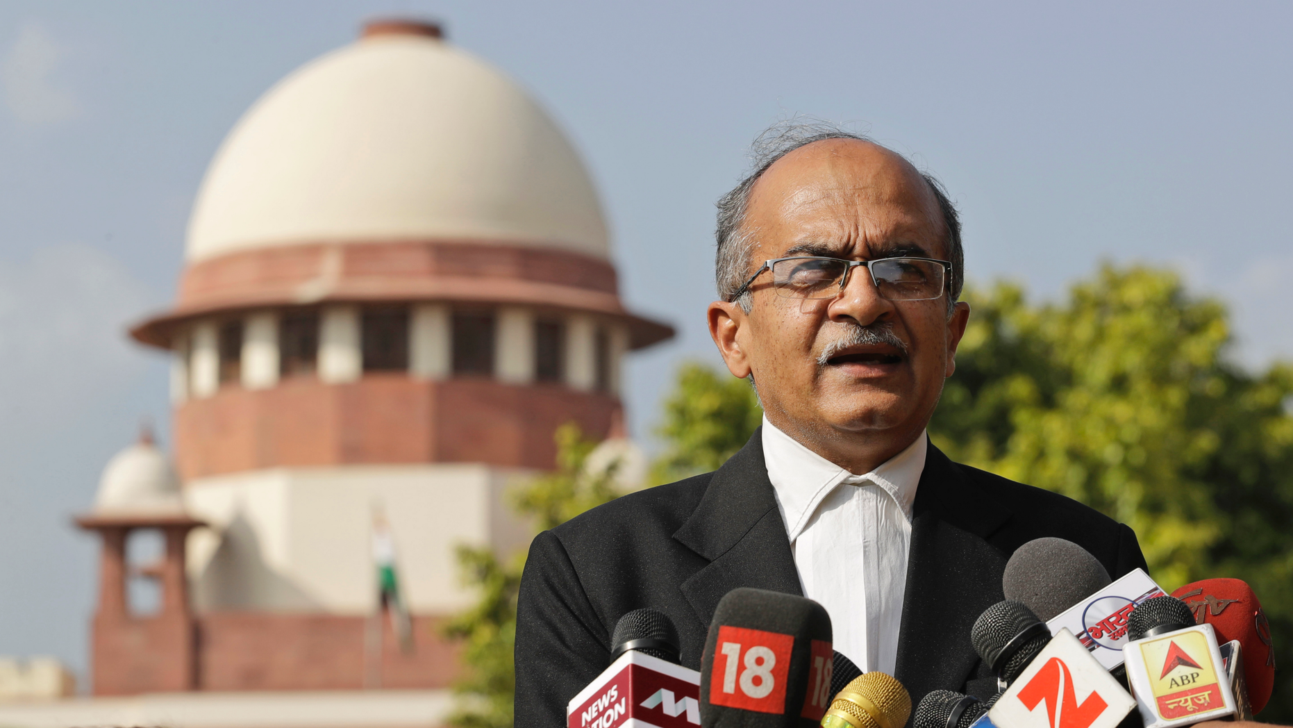 FILE - In this Sept. 4, 2017 file photo, Indian lawyer and social activist Prashant Bhushan speaks to the journalists about the petition filed by two Rohingya Muslim refugees against their deportation to Myanmar, outside the Supreme Court in New Delhi, India. India's top court has allowed the federal government to send seven Rohingya Muslims back to Myanmar in the first deportation of members of the Myanmar minority group since it last year ordered their identification. The Supreme Court on Thursday, Oct. 4, 2018 rejected a plea by Bhushan, a defense attorney, to let them live in India as they feared reprisal in Myanmar. They were arrested in 2012 for entering India illegally and have been held in a prison. (AP Photo/Tsering Topgyal, File)