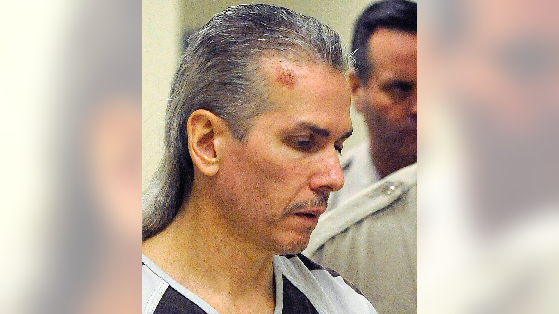 FILE - In this April 13, 2011 file photo, Rodney Berget, who was convicted of killing a Sioux Falls prison guard during an escape attempt, is escorted to court in Sioux Falls, S.D. South Dakota has set Monday as the execution date for Berget. Berget is one of two inmates convicted in the 2011 killing of guard Ronald Johnson during a failed escape attempt at the state prison in Sioux Falls. The other inmate, Eric Robert was executed by lethal injection in 2012. (Elisha Page/Argus Leader via AP, File)