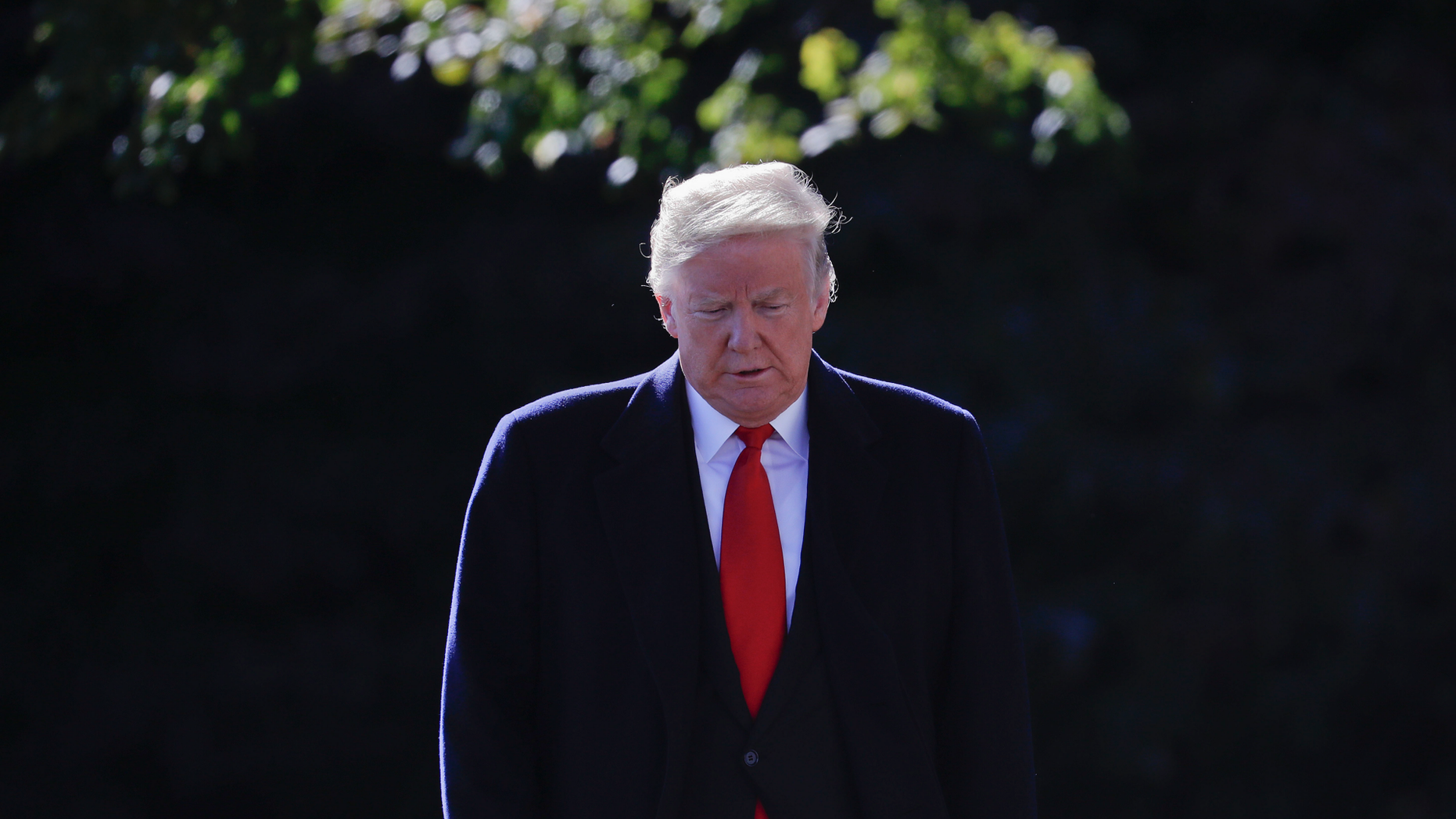 President Donald Trump walks over to talk to members of the media on the South Lawn of the White House in Washington, Monday, Oct. 22, 2018, before boarding Marine One helicopter for a short trip to Andrews Air Force Base, Md., en route to Houston. (AP Photo/Pablo Martinez Monsivais)