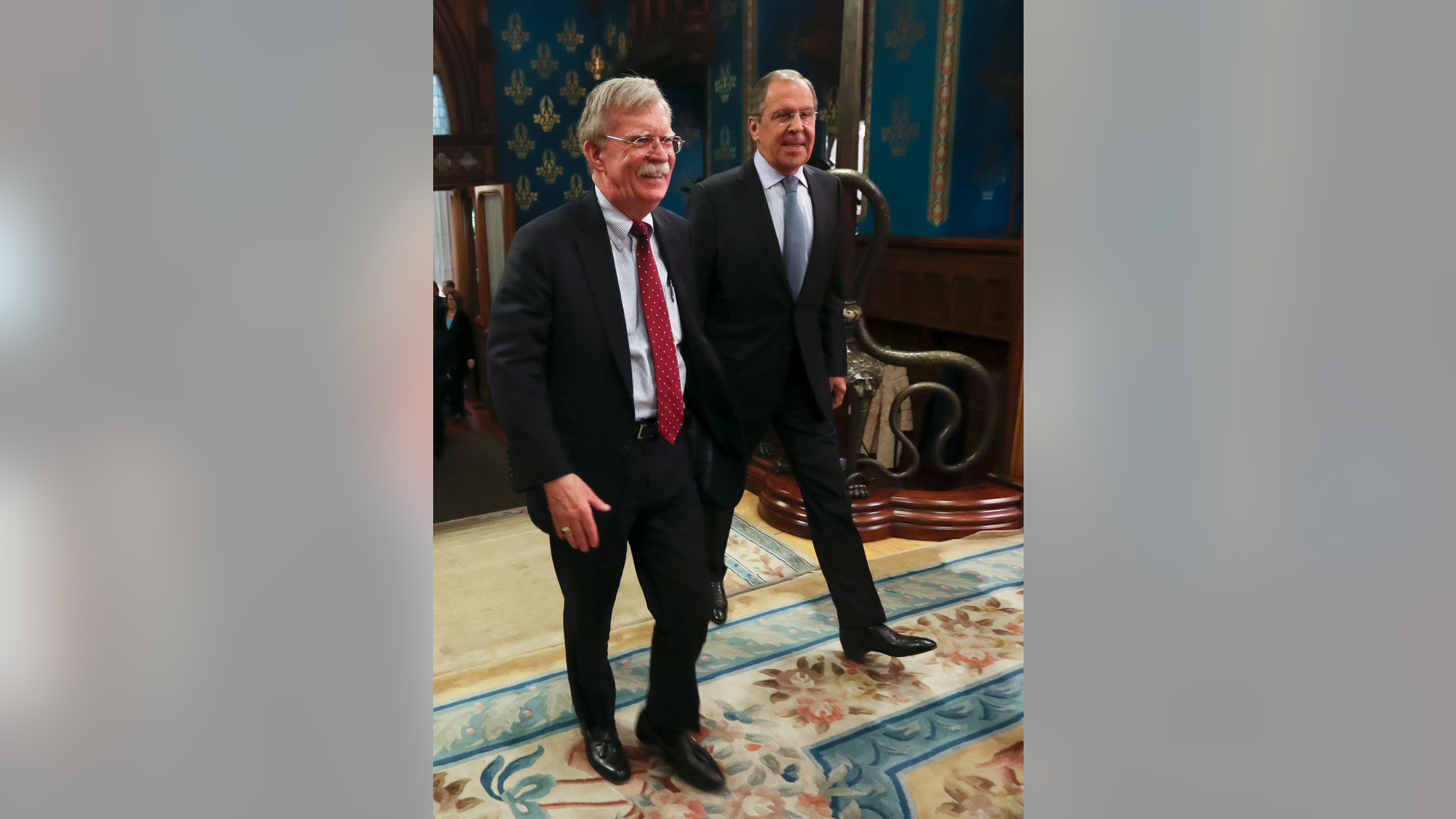 U.S. National Security Adviser John Bolton, left, and Russian Foreign Minister Sergey Lavrov enter a hall for their talks in Moscow, Russia, Monday, Oct. 22, 2018. U.S. President Donald Trump's national security adviser has met with top Russian officials after Trump declared he intended to pull out of a 1987 nuclear weapons treaty. (Russian Foreign Ministry Press Service via AP)