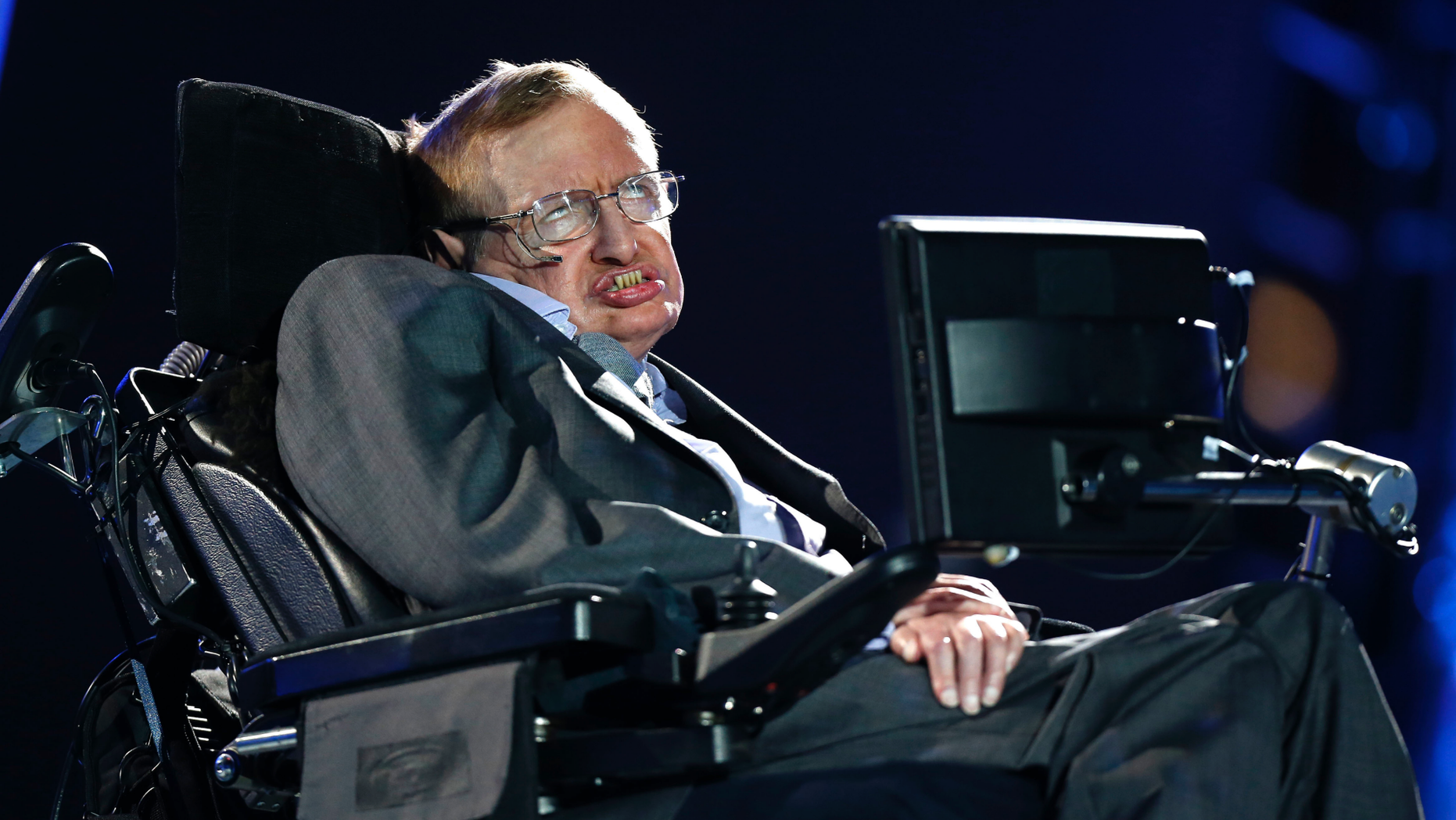 FILE - In this Wednesday Aug. 29, 2012 file photo, British physicist Professor Stephen Hawking speaks during the Opening Ceremony for the 2012 Paralympics in London, Wednesday Aug. 29, 2012. Stephen Hawking has spoken from beyond the grave to warn that science and education are under threat around the world. The words of the scientist, who died in March at 76, were broadcast Monday Oct. 15, 2018 at a London launch event for his final book, "Brief Answers To The Big Questions." (AP Photo/Matt Dunham, file)