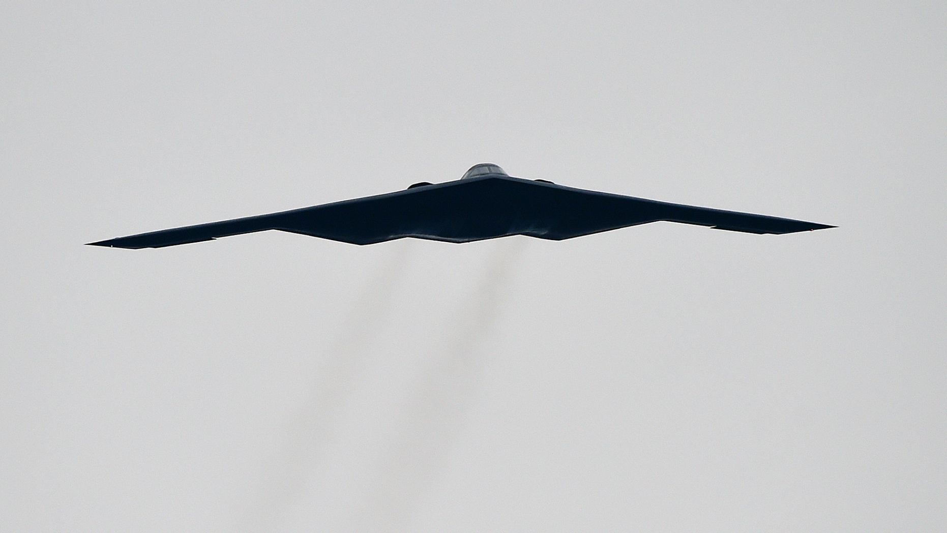 FILE - In this Oct. 25, 2015, file photo, a U.S. Air Force B2 Spirit stealth bomber performs a flyover at the Talladega Superspeedway in Talladega, Ala. The Air Force says a Missouri-based B2 landed in Colorado Springs, Colo., on Tuesday, Oct. 23, 2018, after an unspecified emergency. Neither of the pilots was injured. (AP Photo/Mark Almond, File)