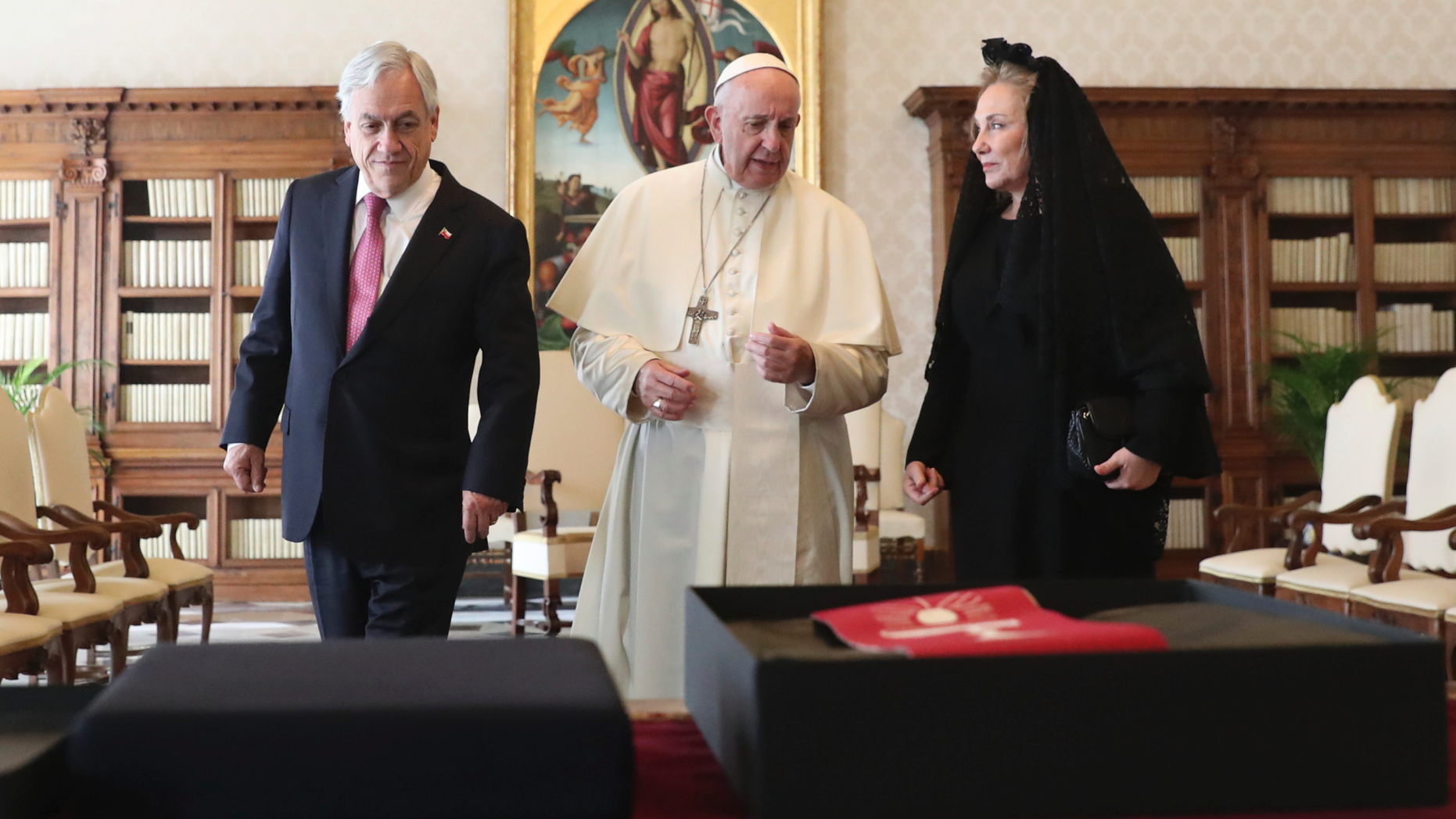 Pope Francis speaks as he meets with Chile's President Sebastian Pinera and his wife Cecilia Morel during a private audience at the Vatican, Saturday, Oct. 13, 2018. (Alessandro Bianchi/Pool Photo via AP)