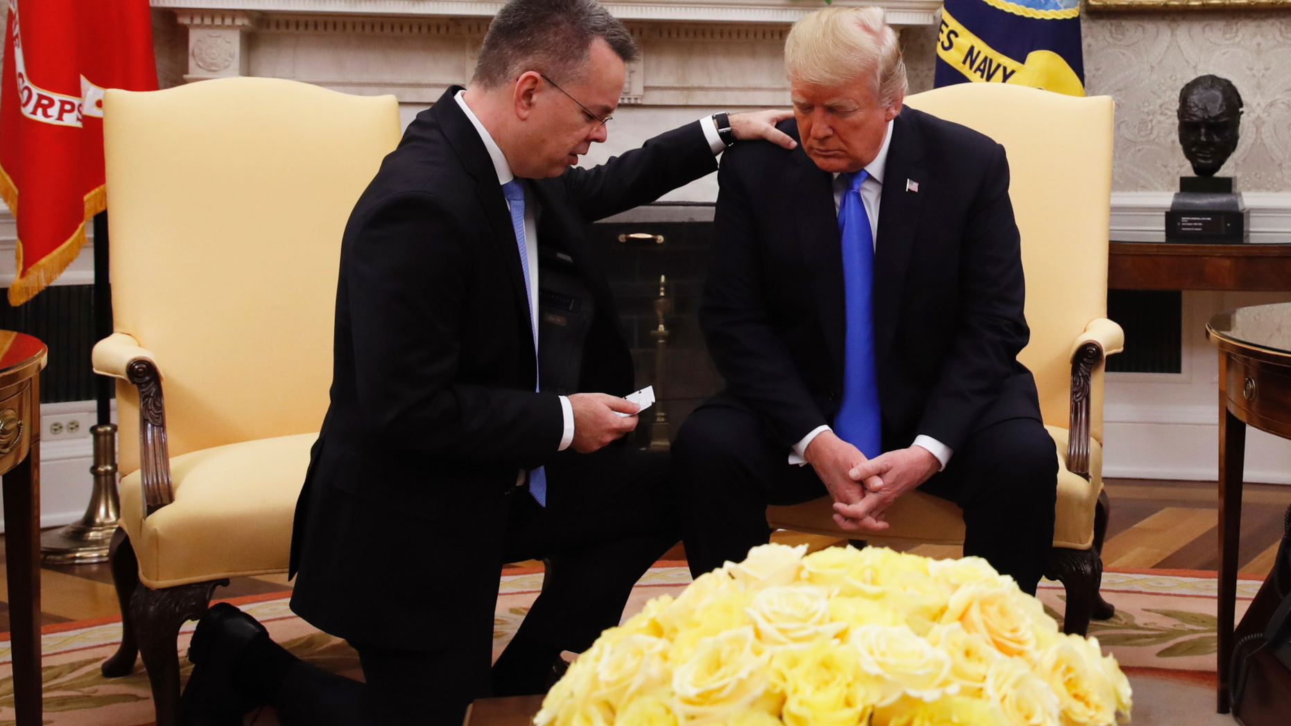 President Donald Trump prays with American pastor Andrew Brunson in the Oval Office of the White House, Saturday October 13, 2018, in Washington. Brunson returned to the U.S. around midday after he was freed Friday, from nearly two years of detention in Turkey. (AP Photo/Jacquelyn Martin)