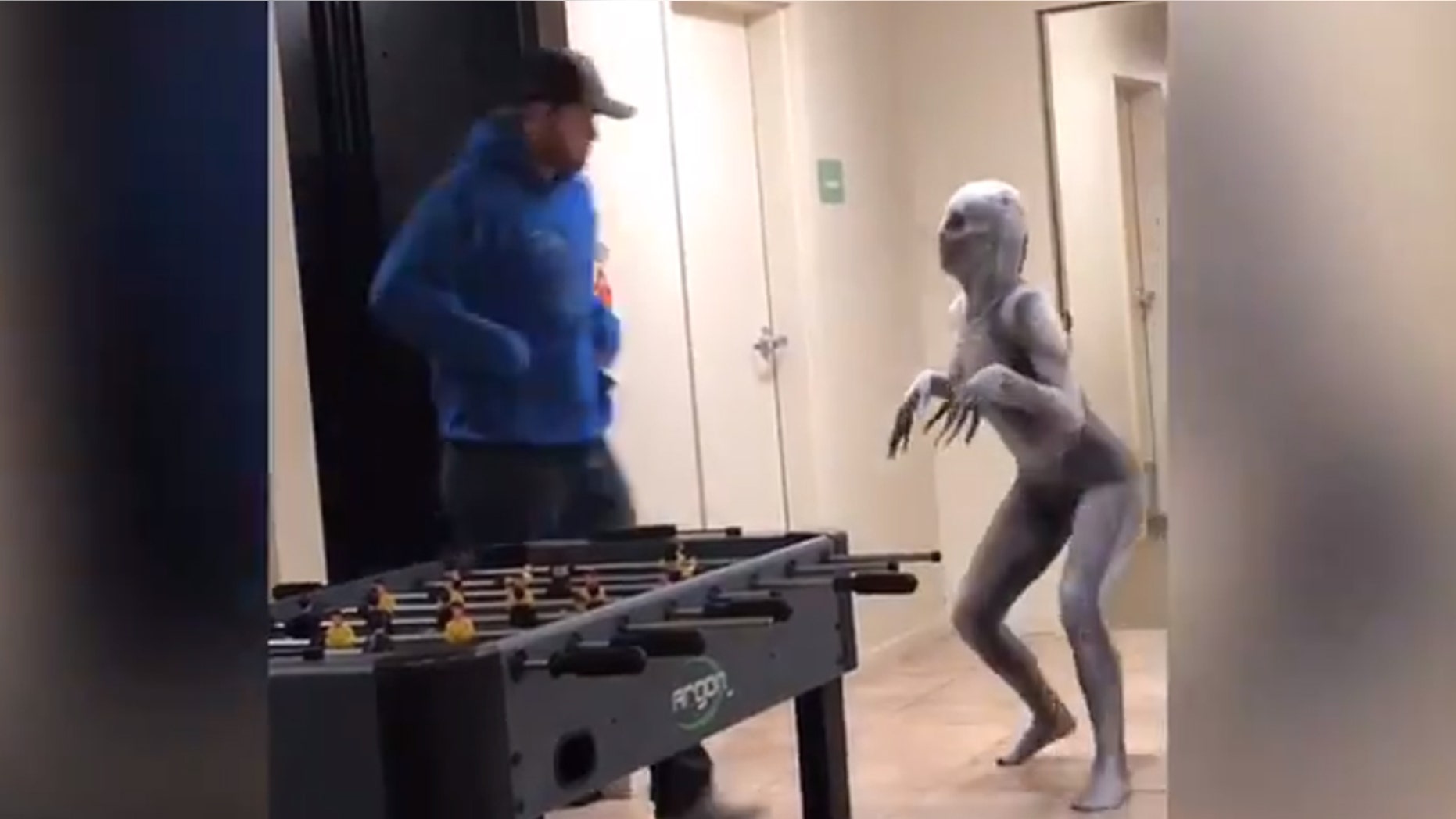 In the footage, Martinez sports a silver-colored, skeletal bodysuit — complete with a spooky mask and extra-long fingers — that zips to conceal her entire frame, as she prances around and scares passersby in the lobby of an apartment building at her college.