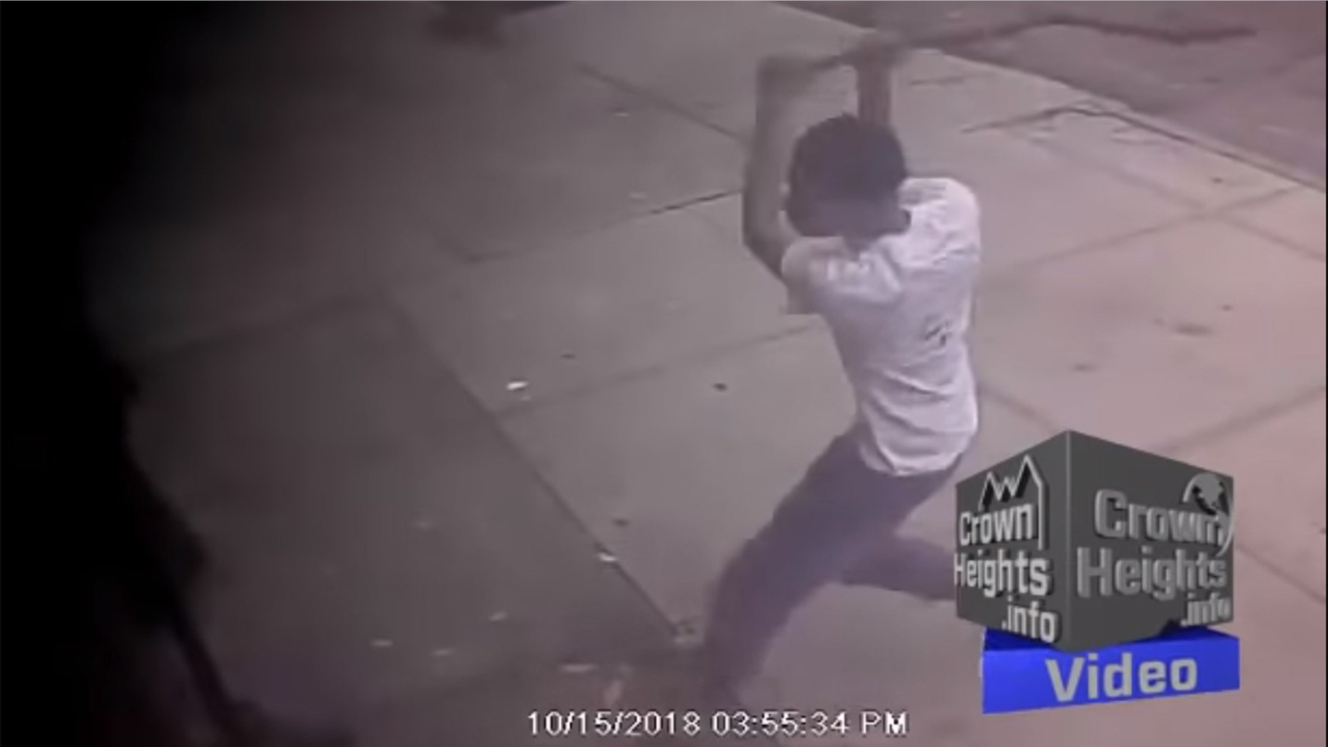 This surveillance photo shows an unidentified teenager attacking a Jewish man in a Brooklyn neighborhood.